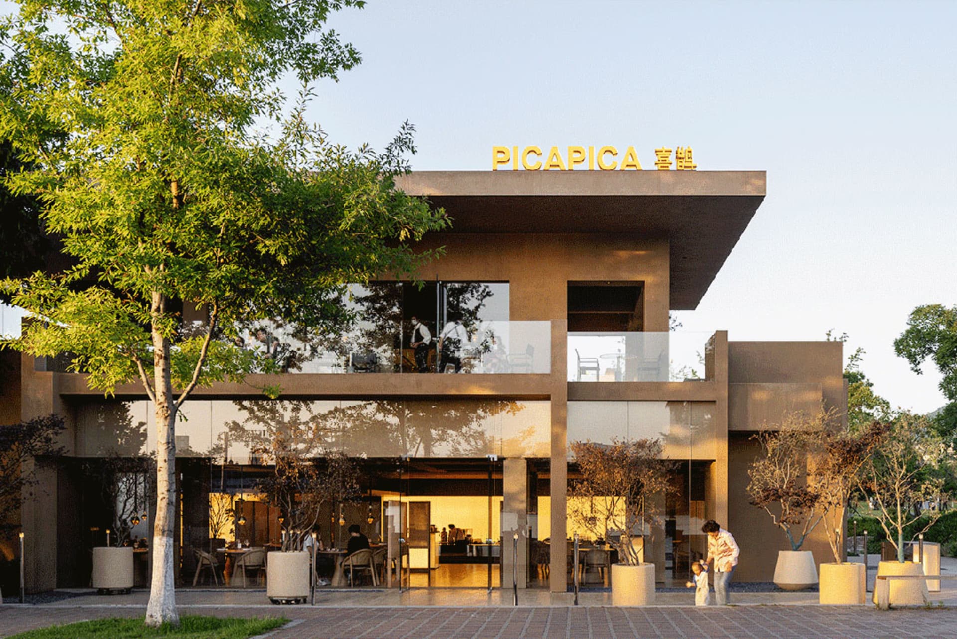 A modern commercial building with glass façade and minimalist design.