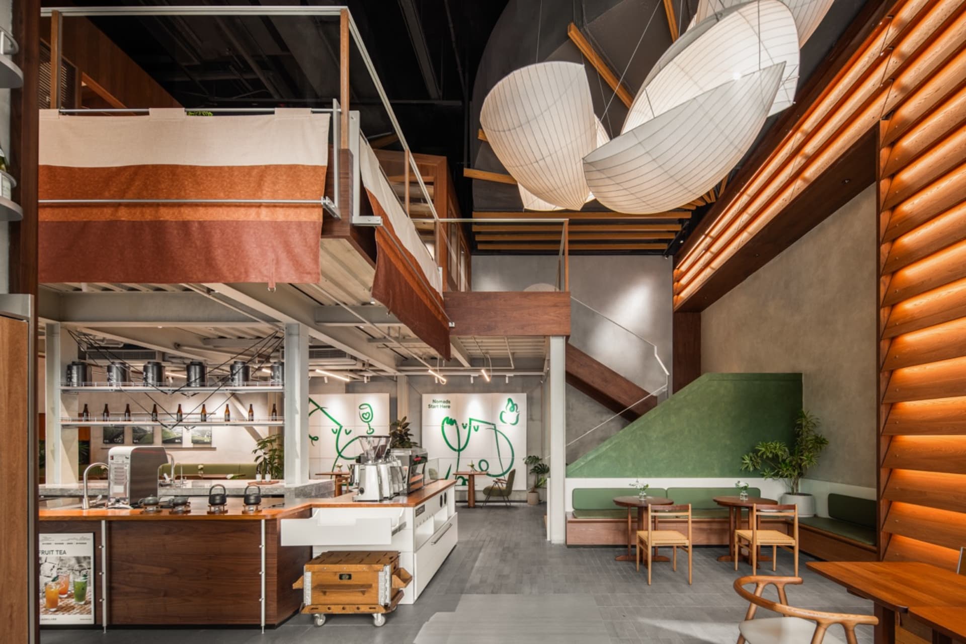 Modern industrial cafe with wooden panels and concrete ceiling, featuring a multi-level interior design with a bar area and s