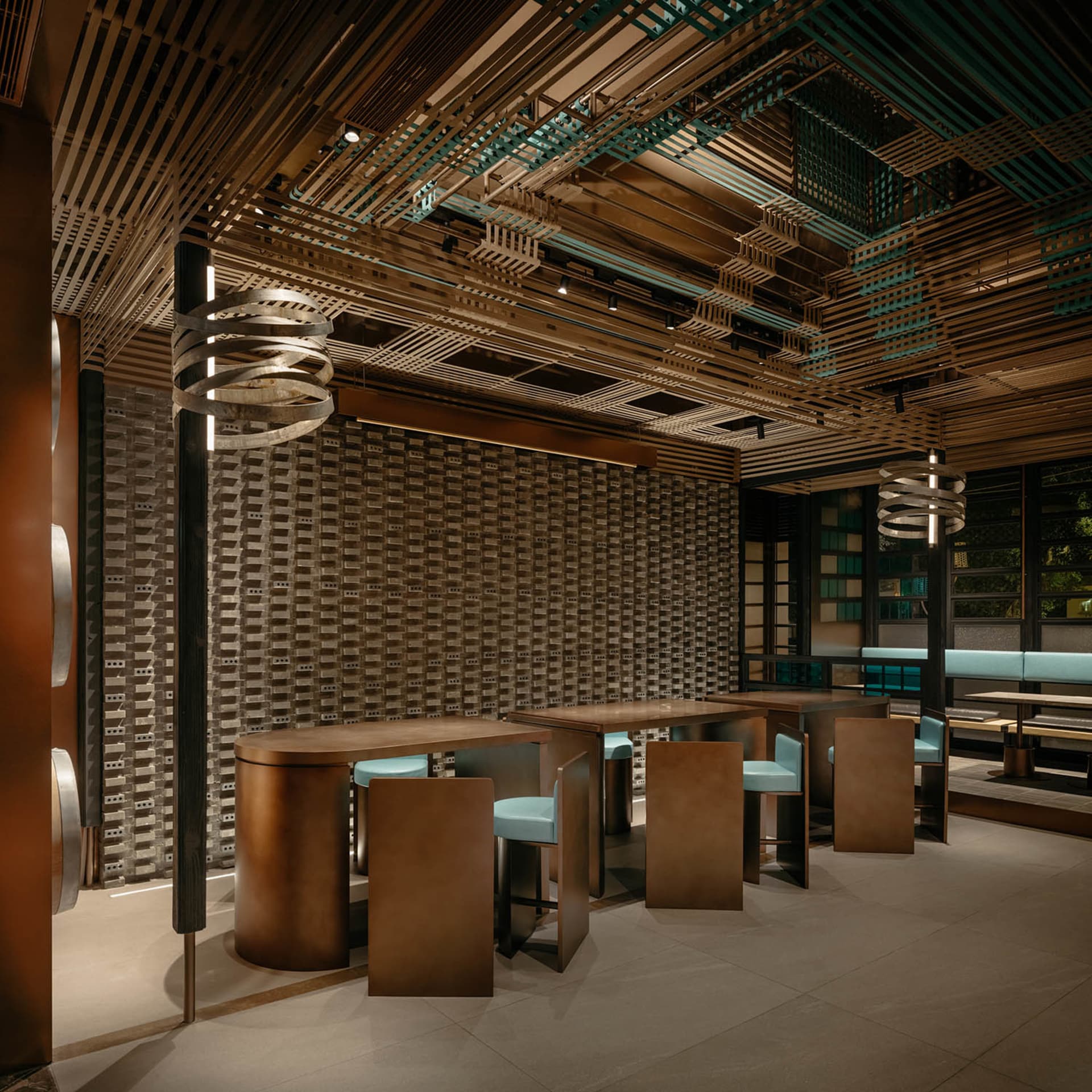 A modern restaurant interior featuring wood laminate tables and chairs.