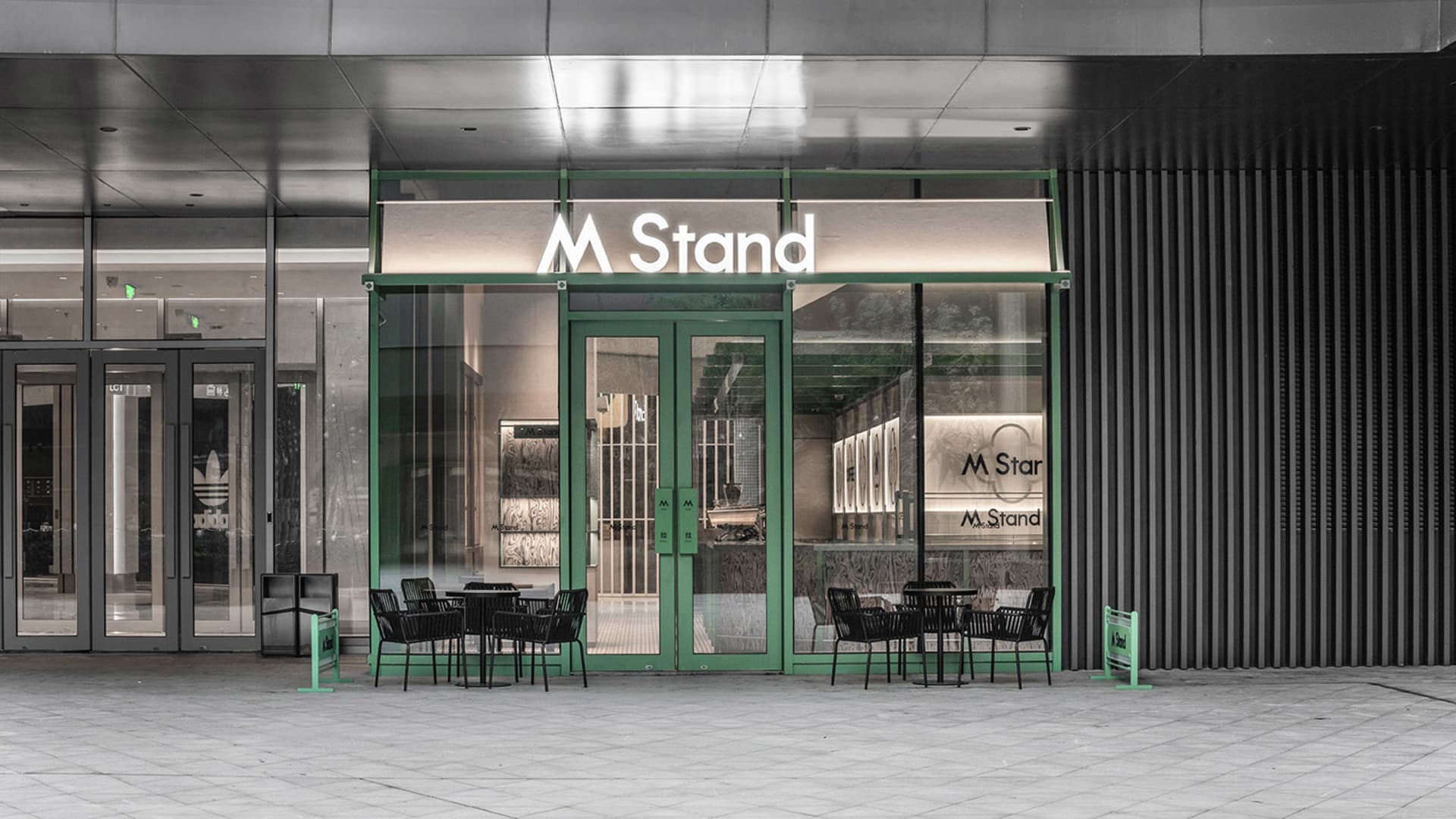 A modern retail storefront with glass windows and doors