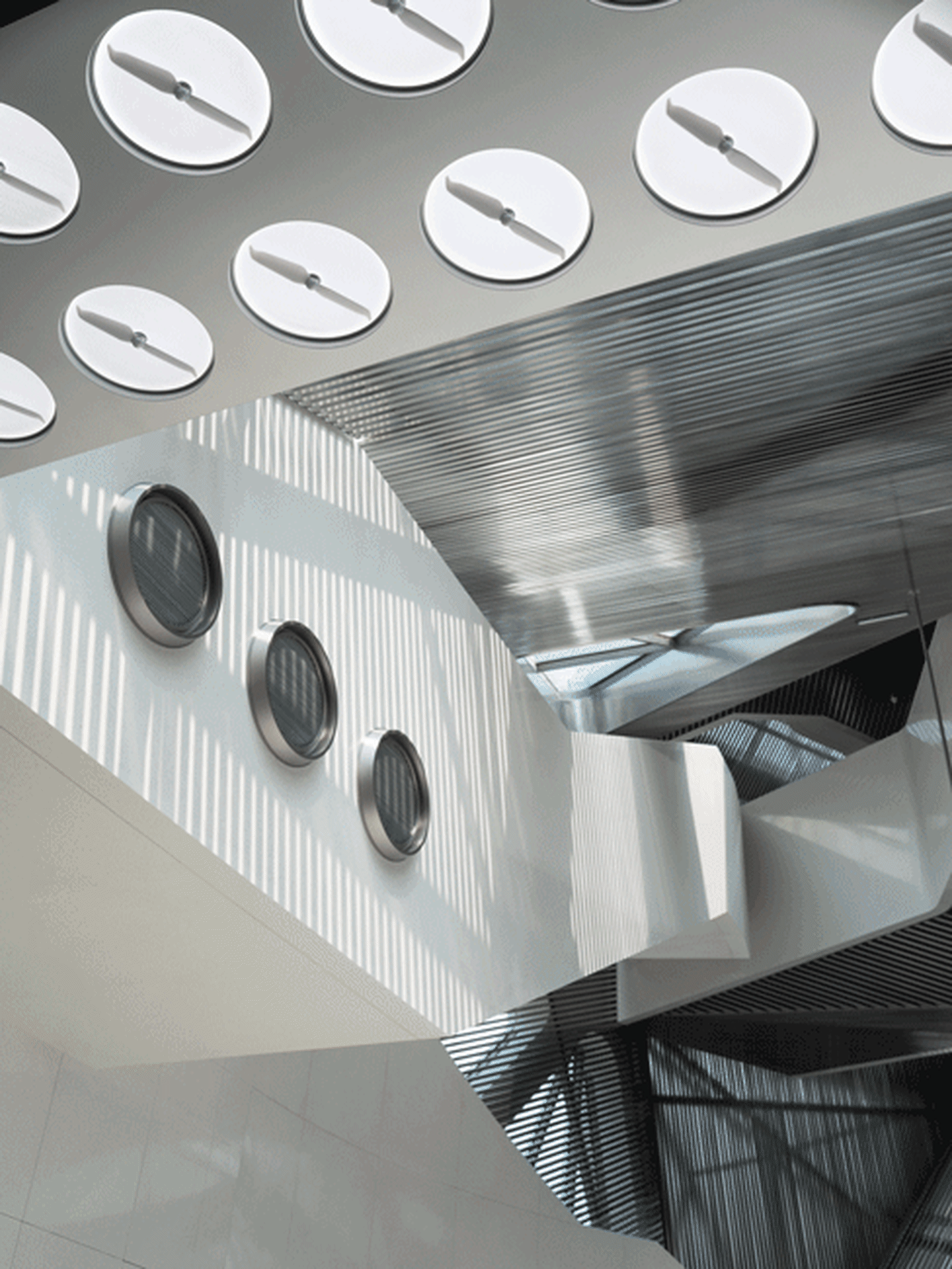 A metallic ceiling with circular elements.