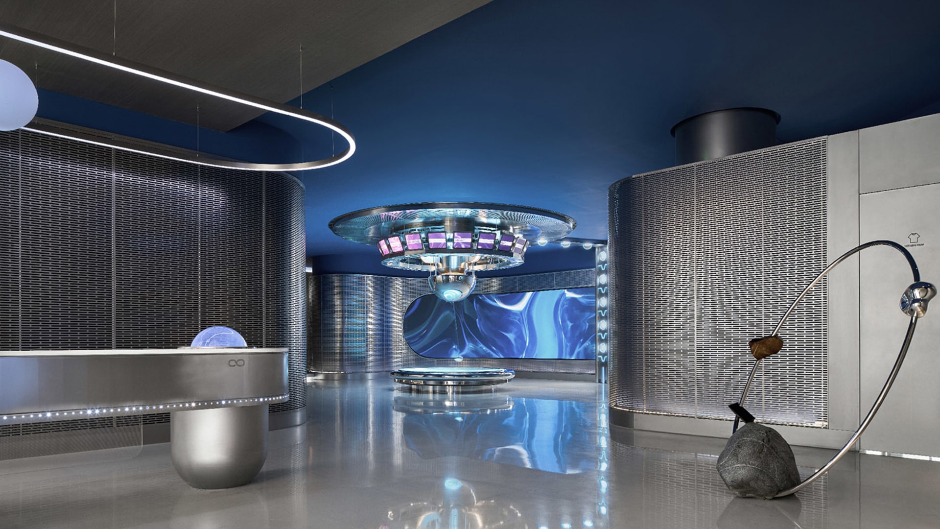 Modern lounge area with metallic structures and glass elements