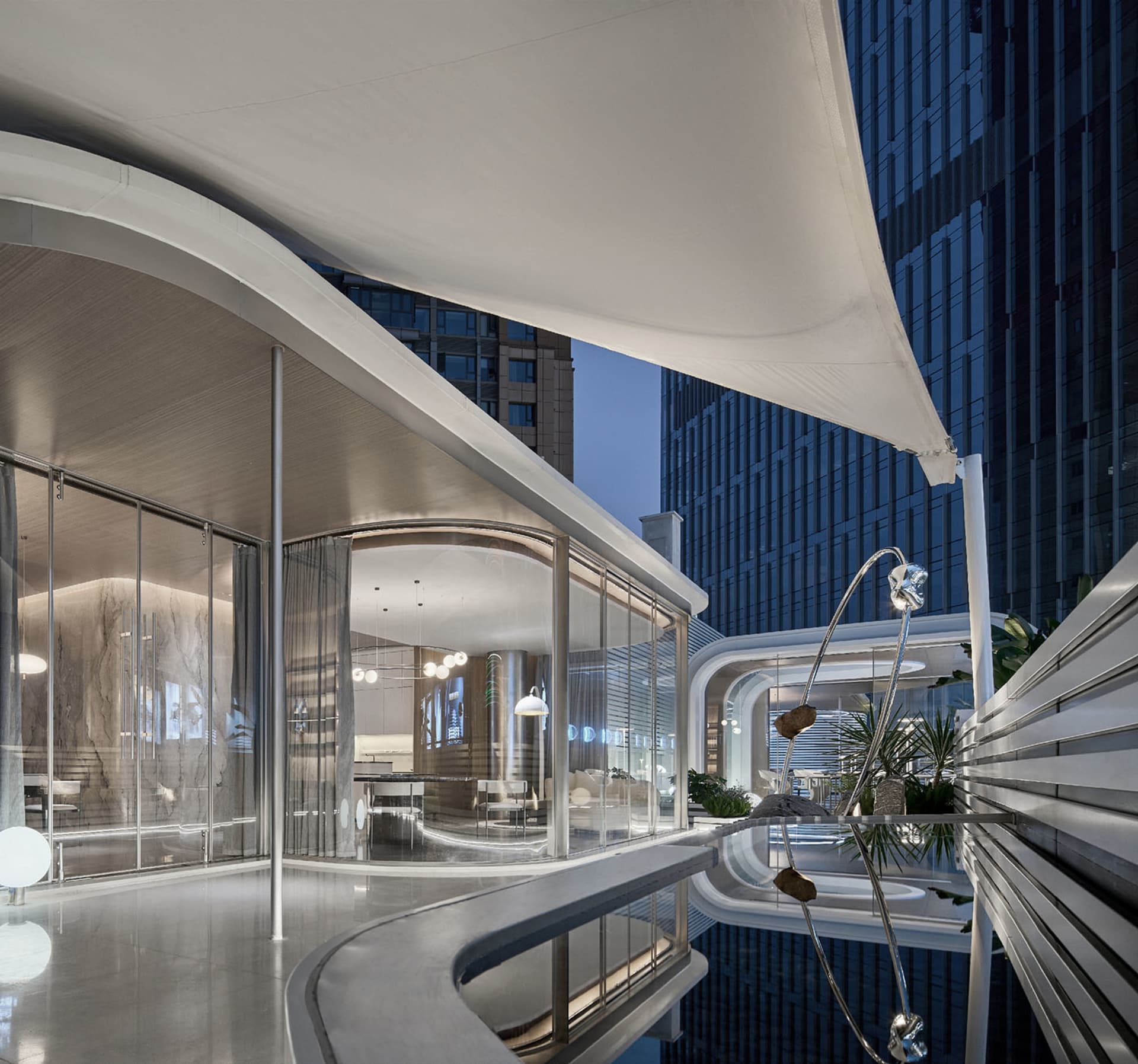 Modern hotel suite featuring sleek glass, concrete, and marble interiors