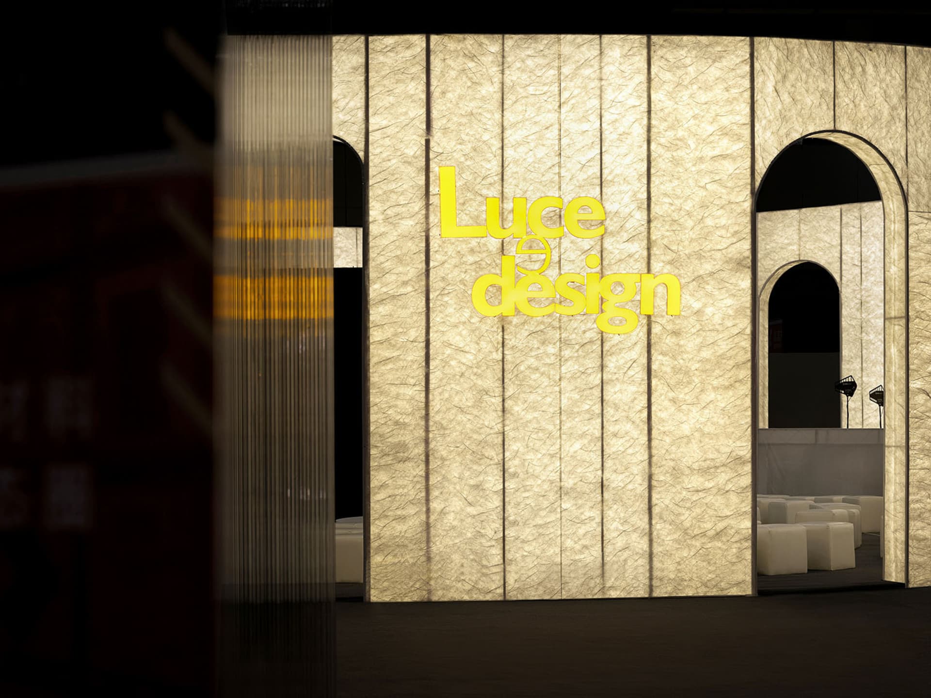 A textured paper facade with the words "Luce Design" on it.