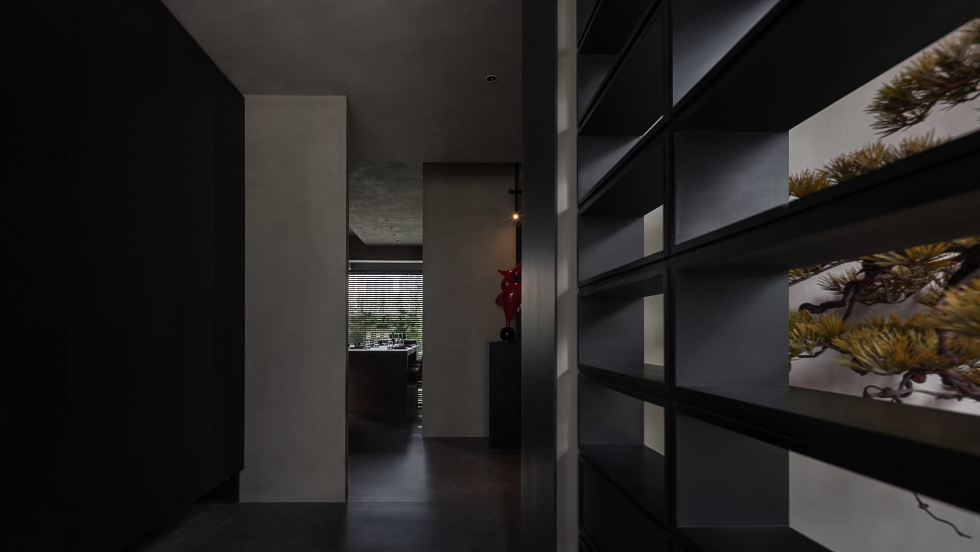 A modern interior space featuring glass elements.