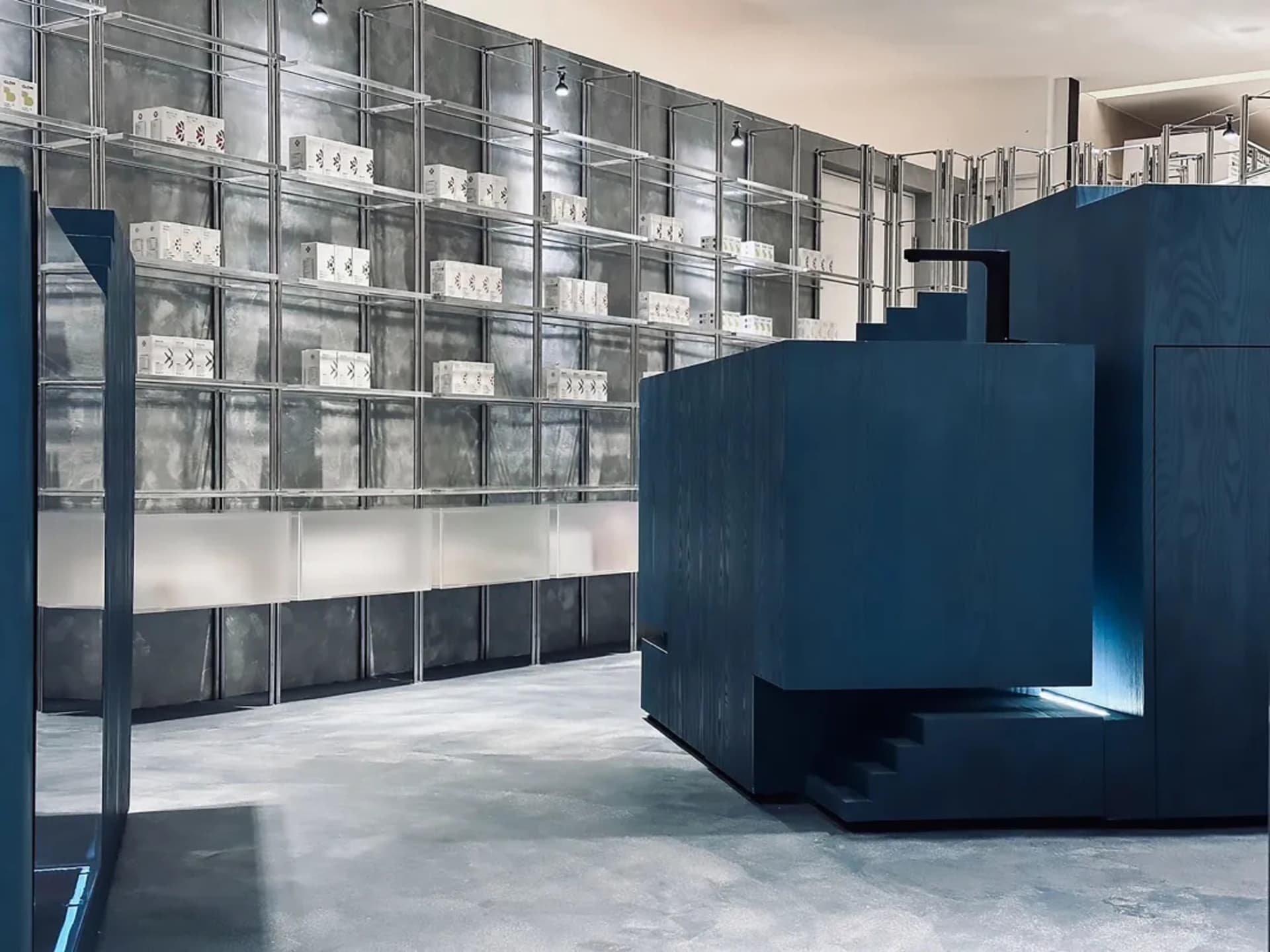 Modern retail storefront with metal shelving and concrete floors