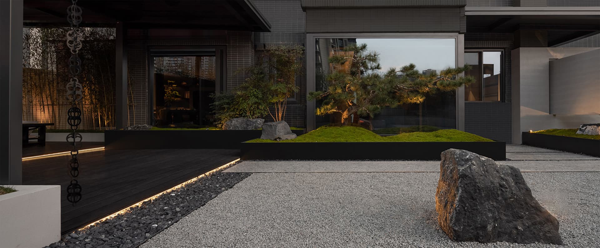 Modern landscape design featuring concrete elements and plants.