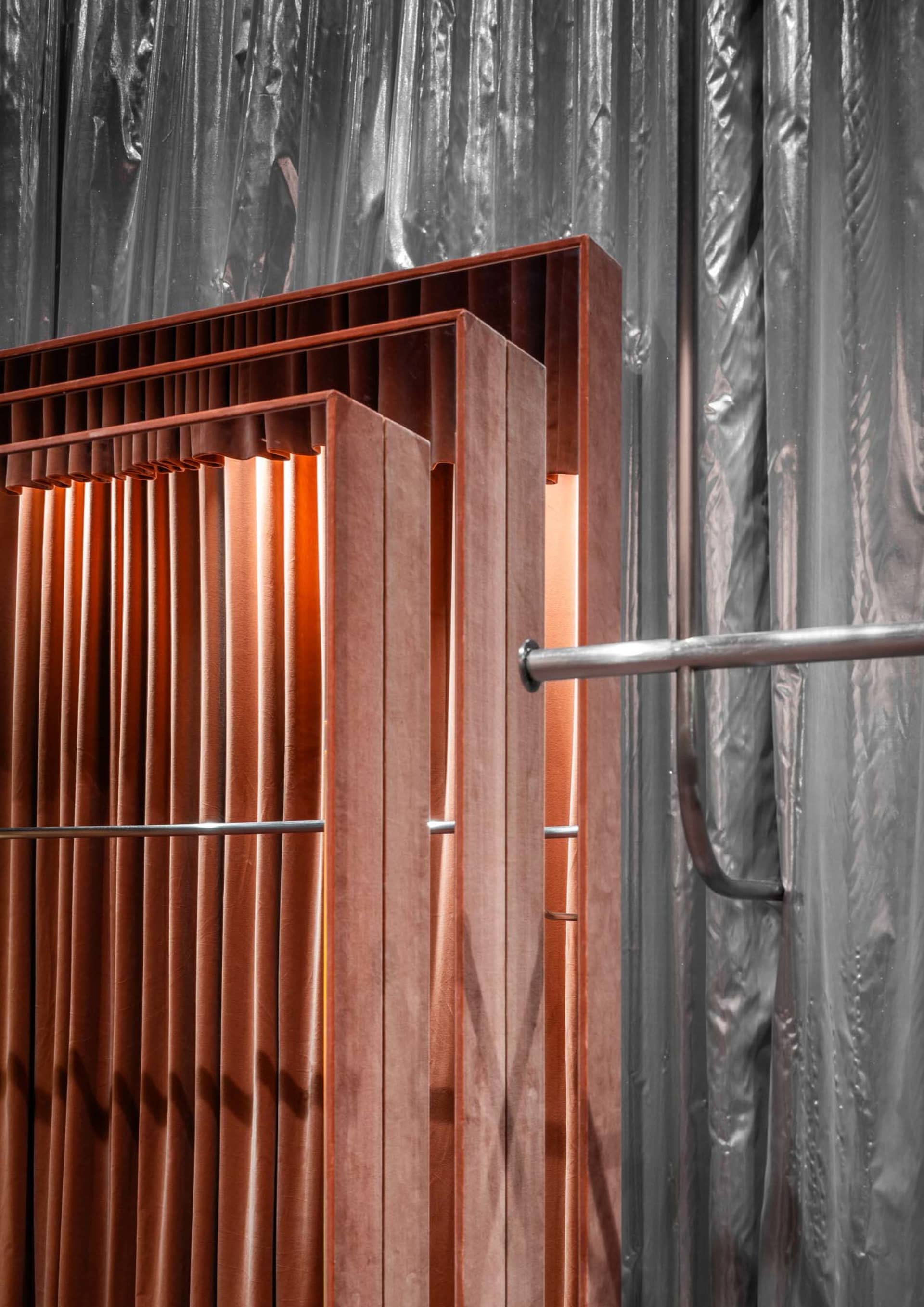 Metal industrial desk with a pipe frame and wooden top.