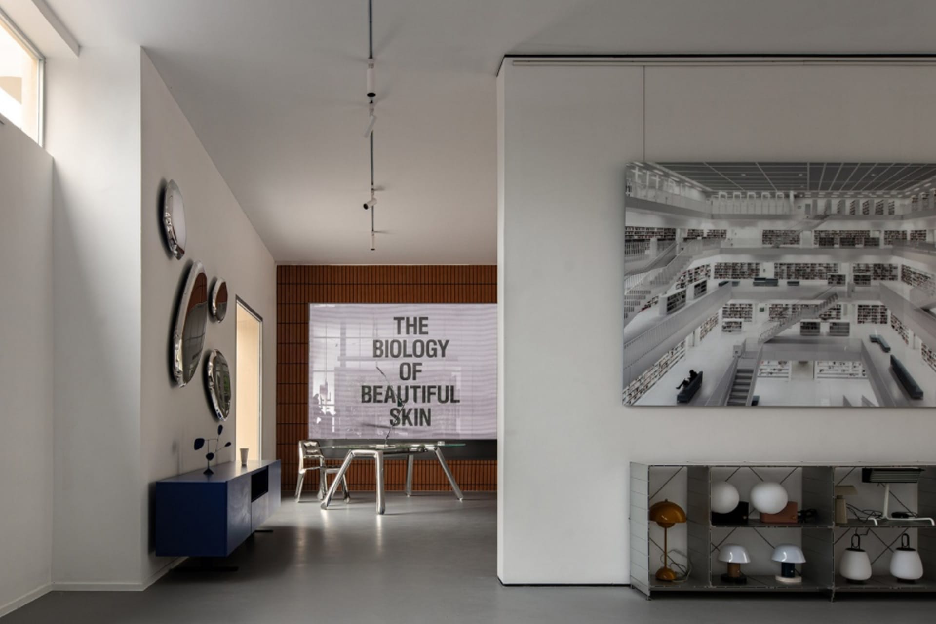 Contemporary interior space featuring a white room with a glass wall and minimalistic decor.