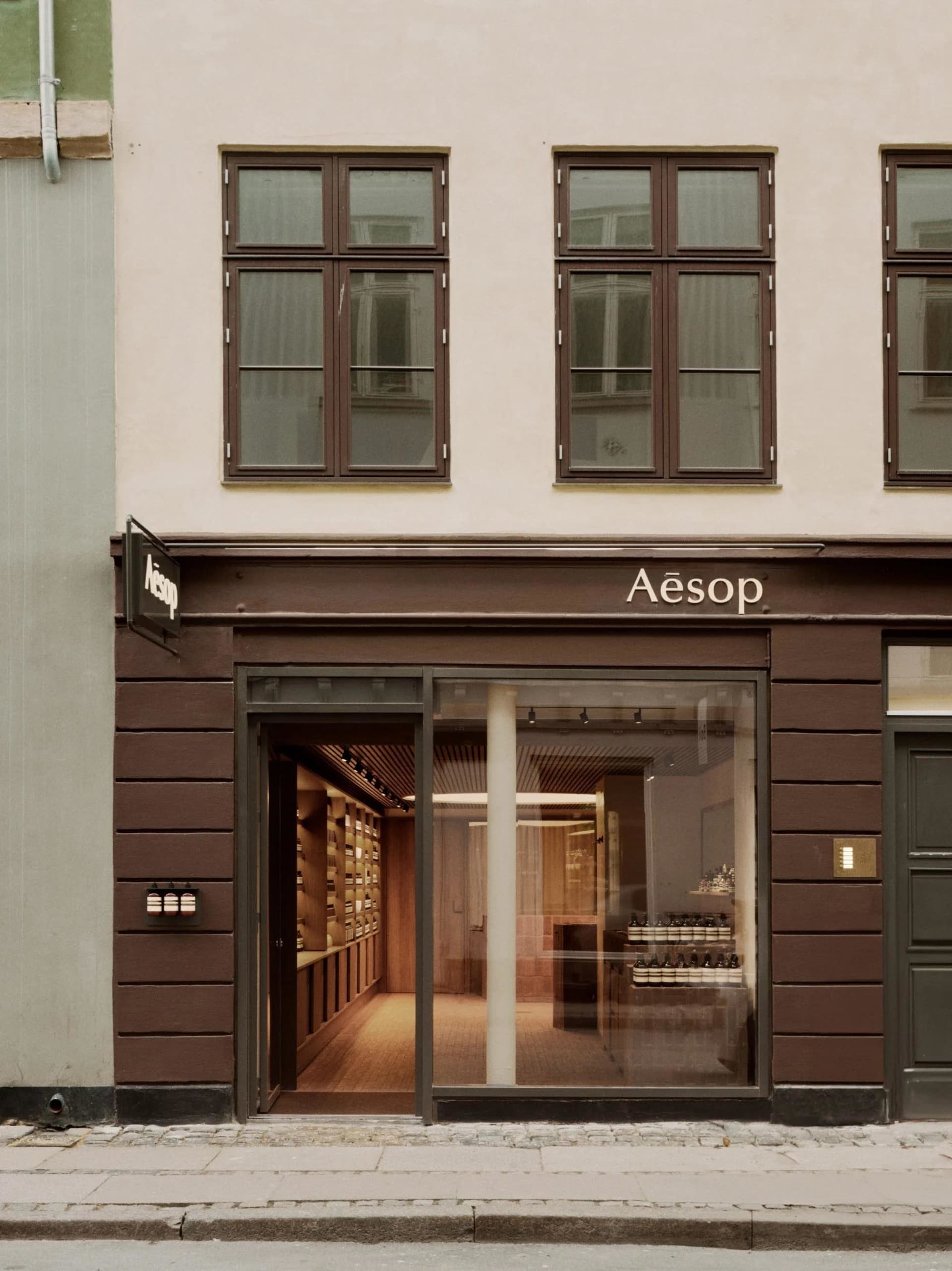 Aesop storefront with glass and wooden elements