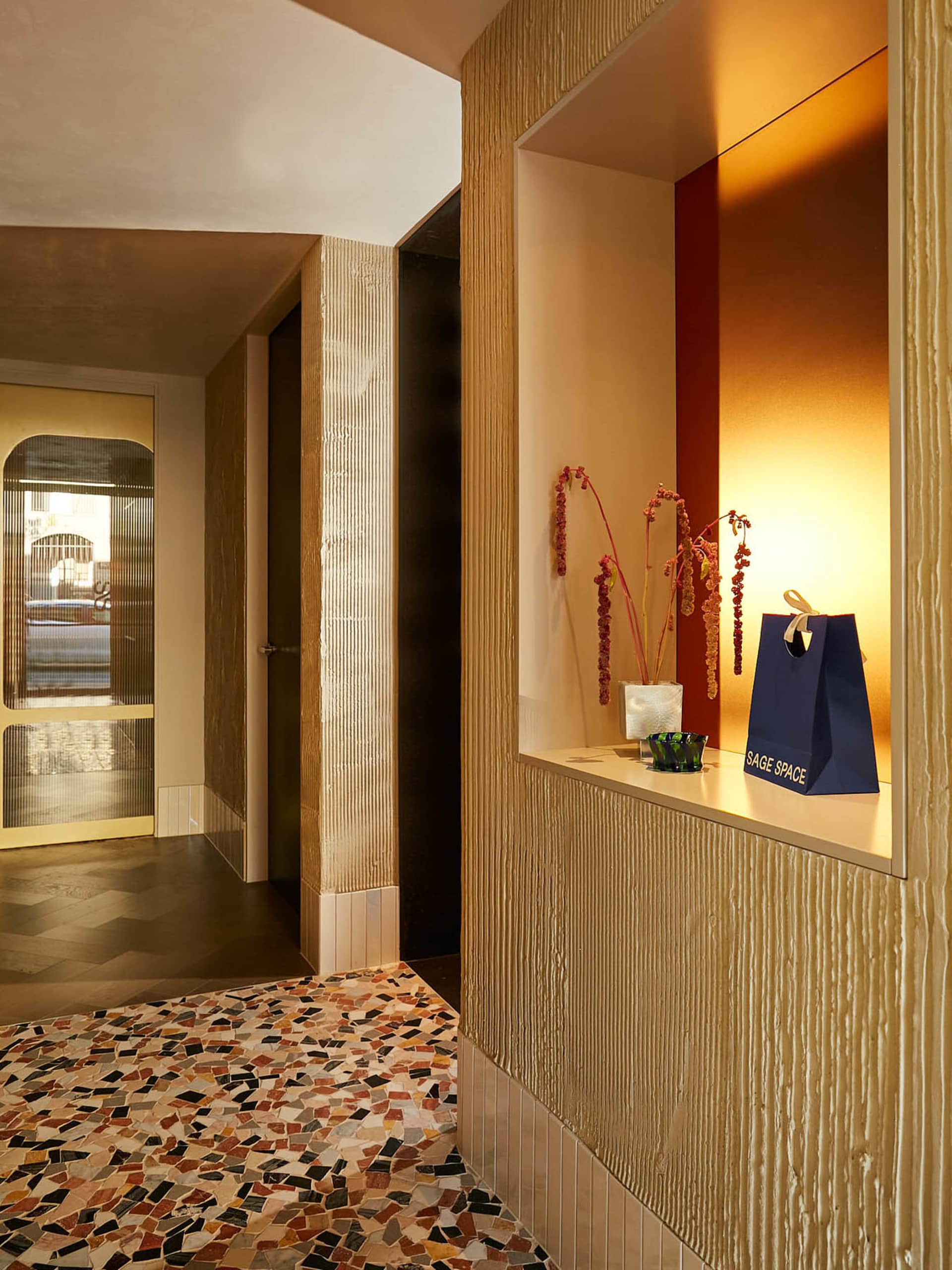 An interior design image of a retail storefront with terrazzo tile flooring.