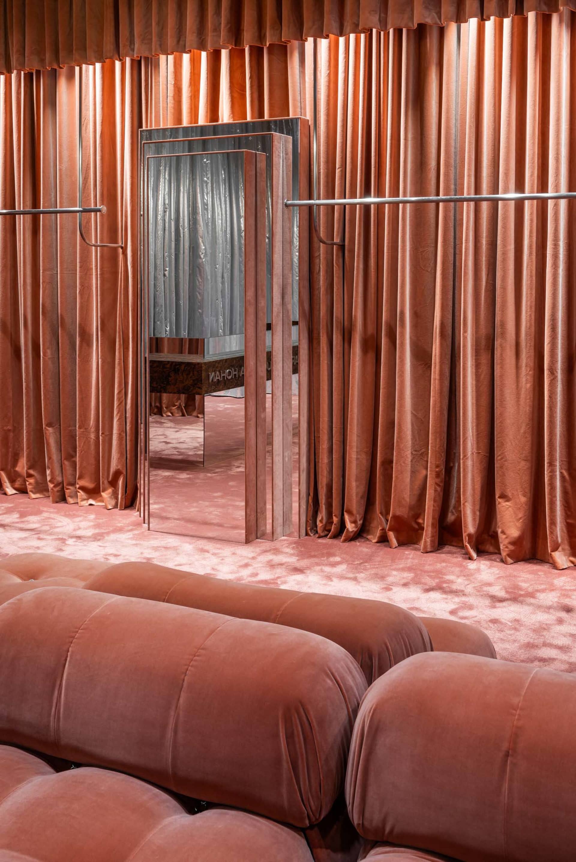 A clothing shop interior with velvet cloth curtains, showcasing a luxurious and elegant atmosphere.