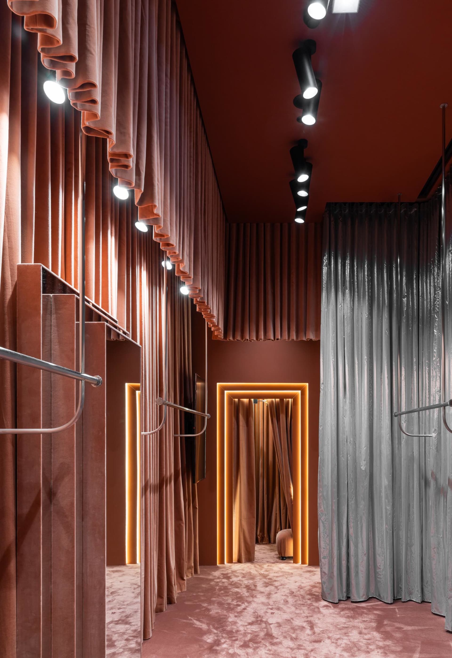 Industrial-style retail shop featuring curtains and LED lighting fixtures