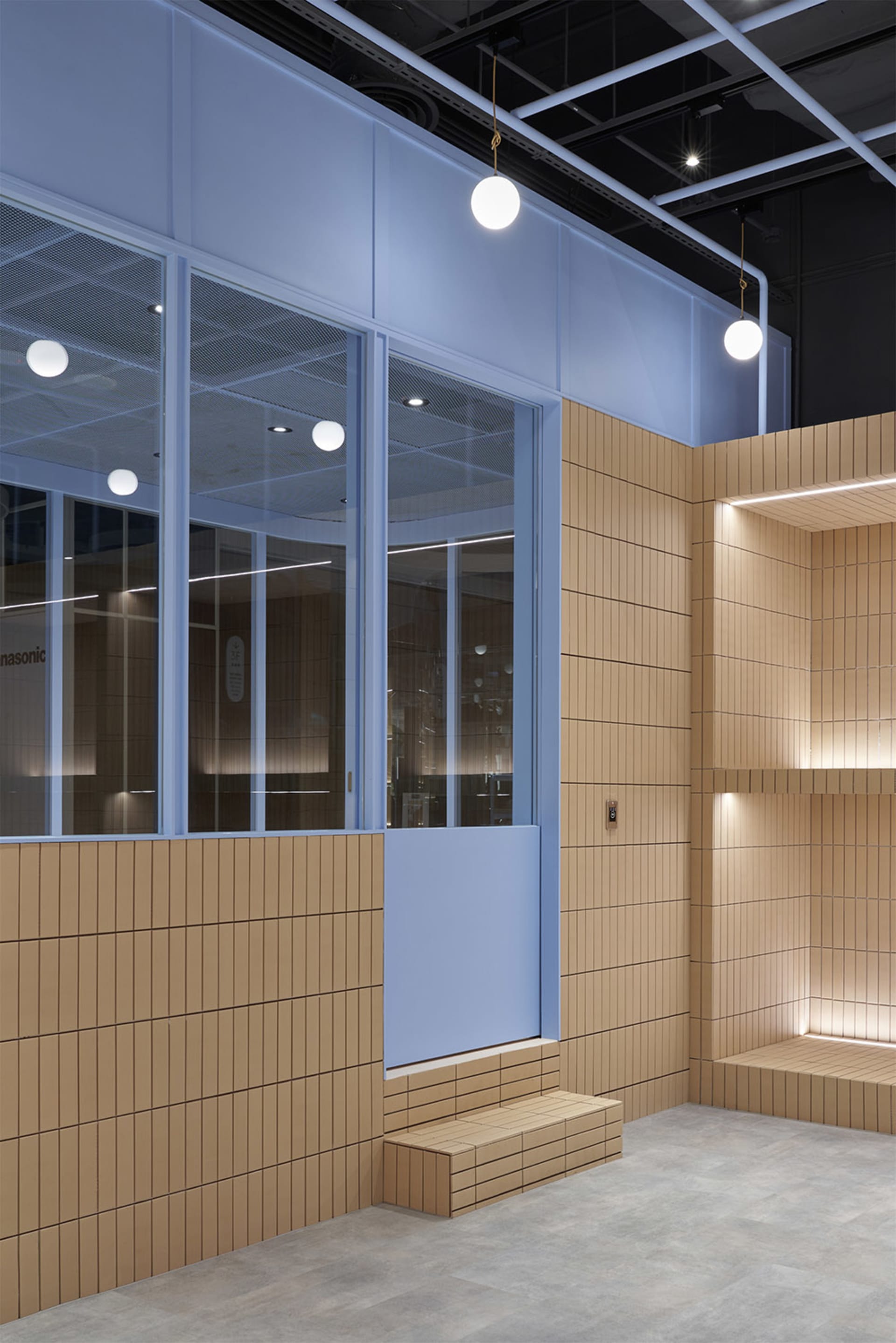 Modern conference room with tiled walls and concrete floor