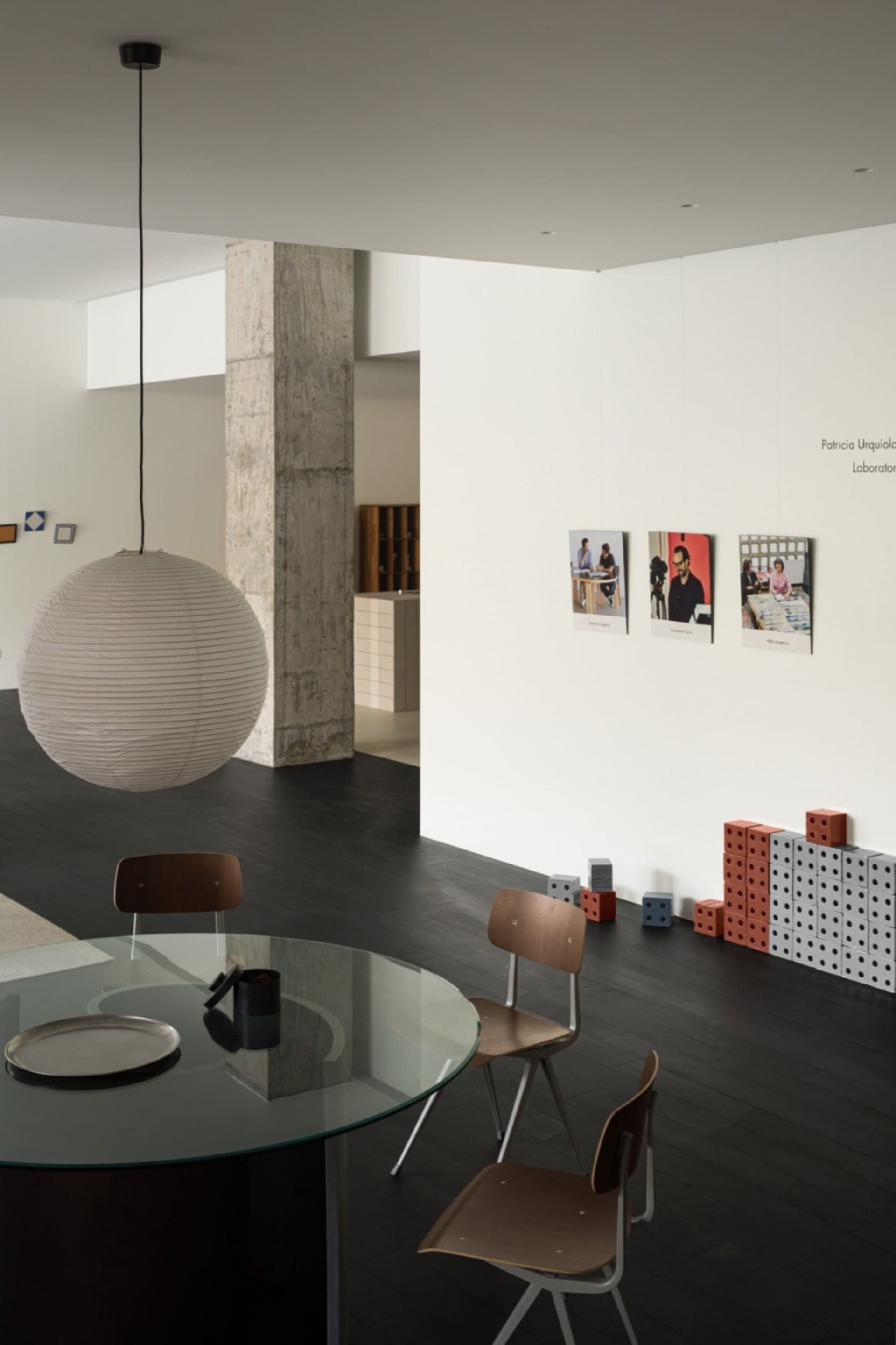 Modern living space featuring concrete and glass materials in a modern interior design setting.