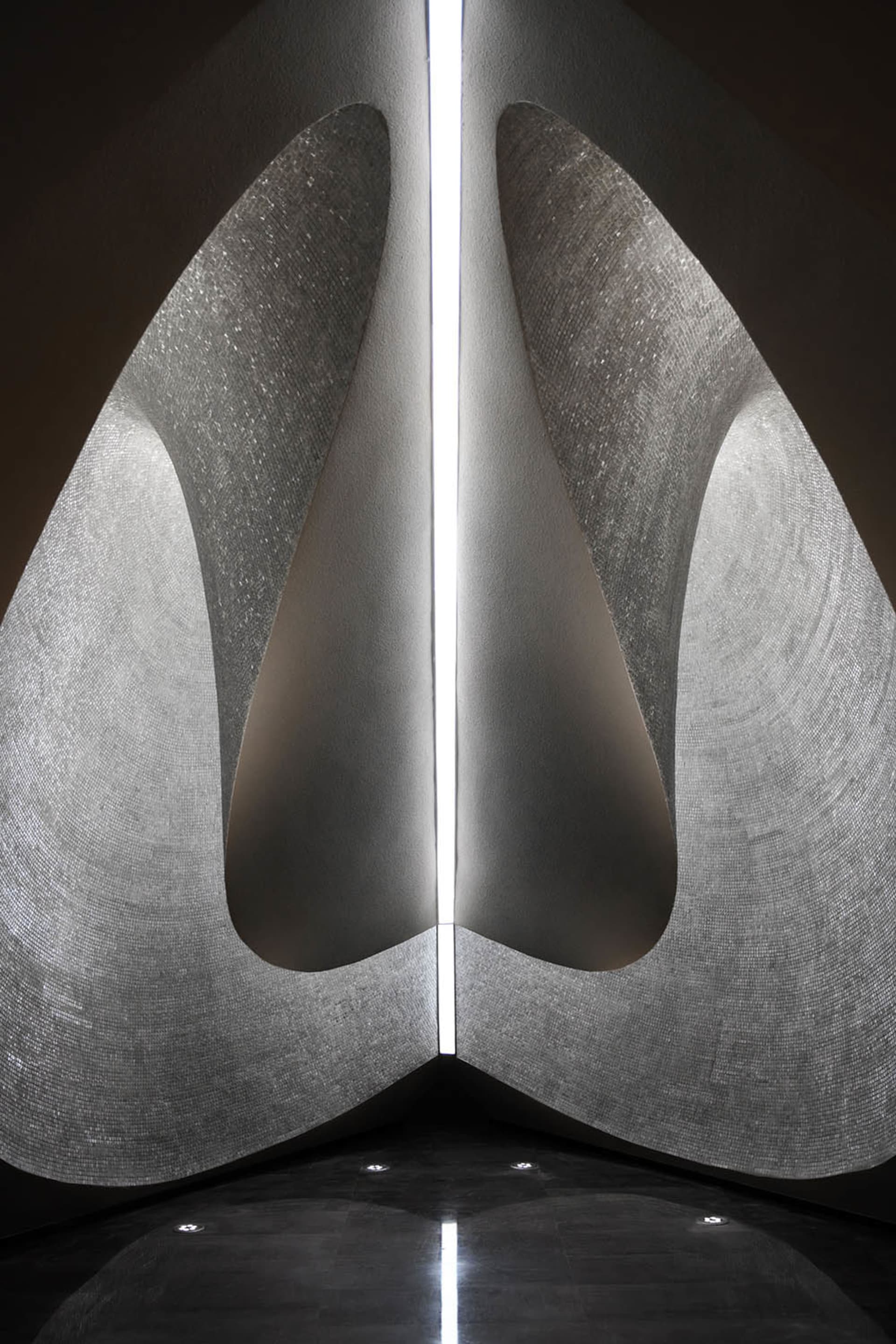 Modern architectural design featuring a column constructed from textured tile.