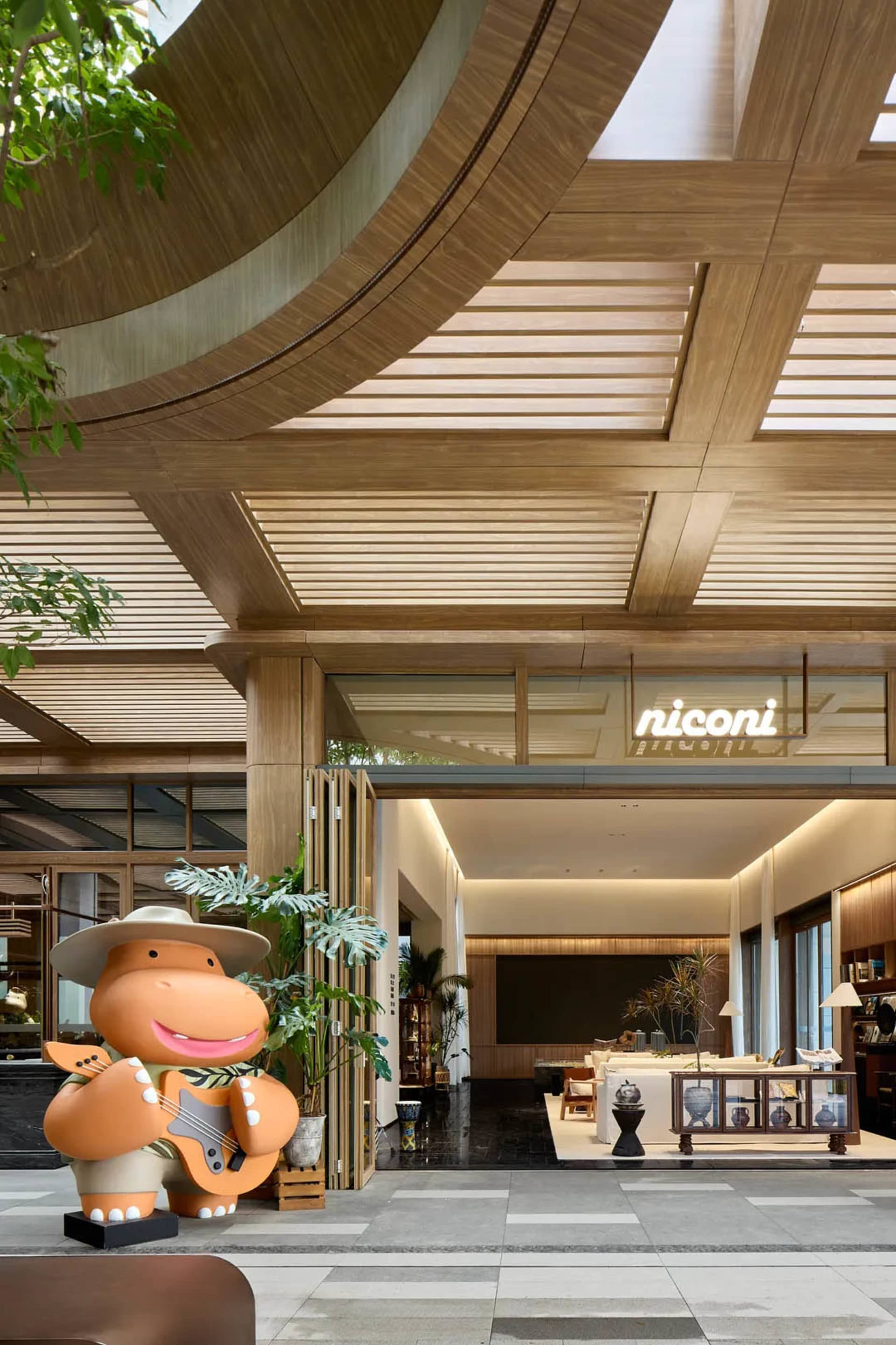 A modern hotel lobby featuring wooden elements.