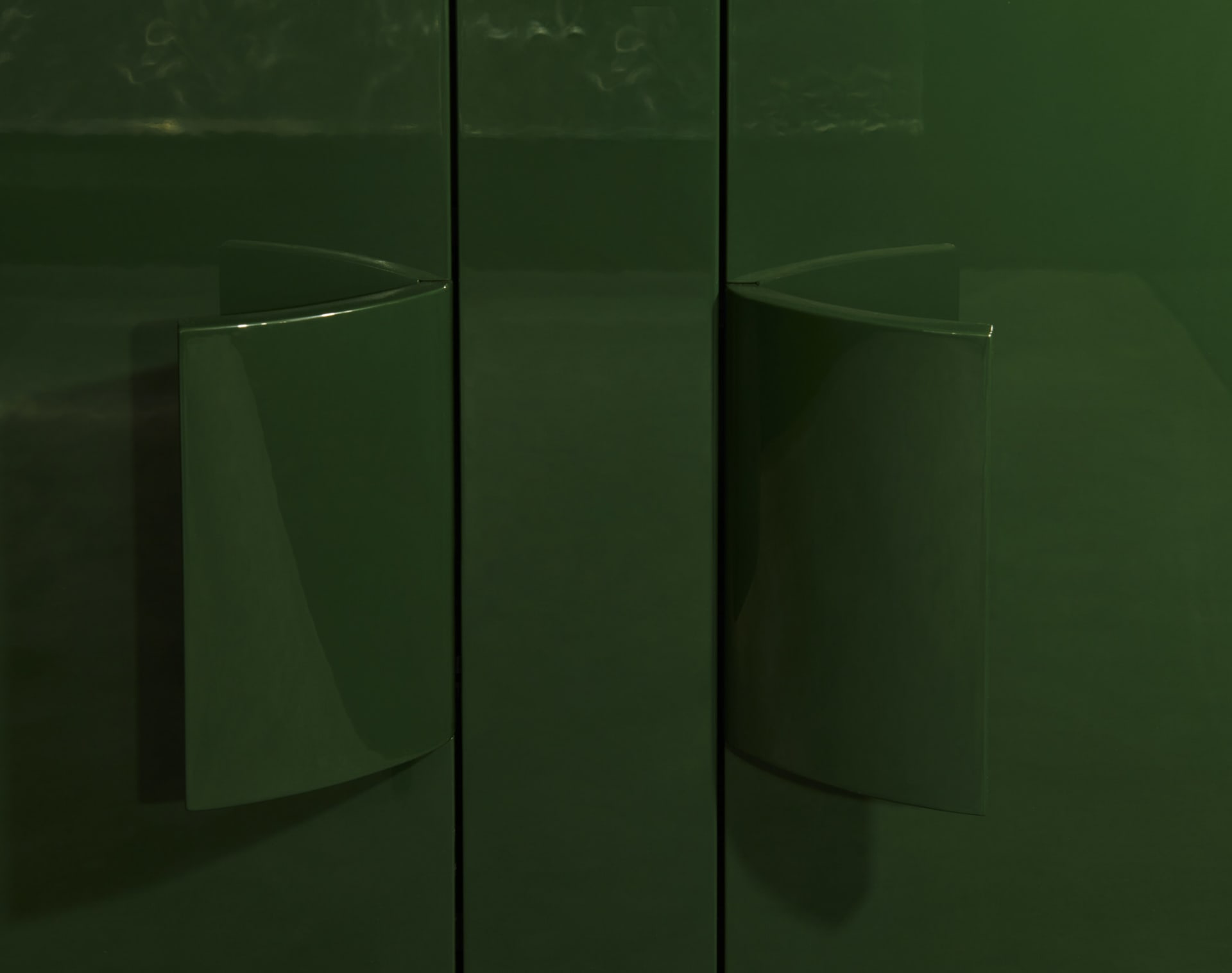 A modern interior design featuring green metal elements.