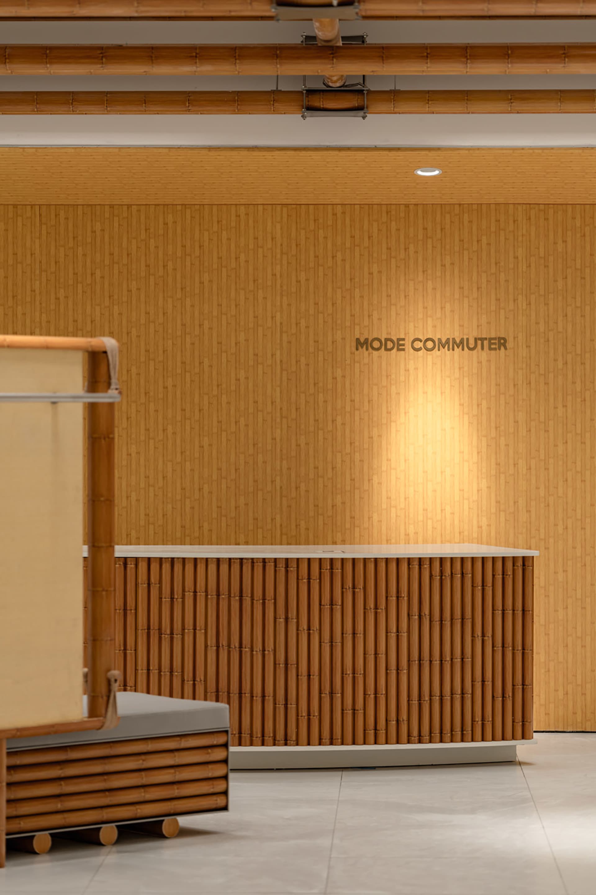 A modern reception desk with a wood paneling design.