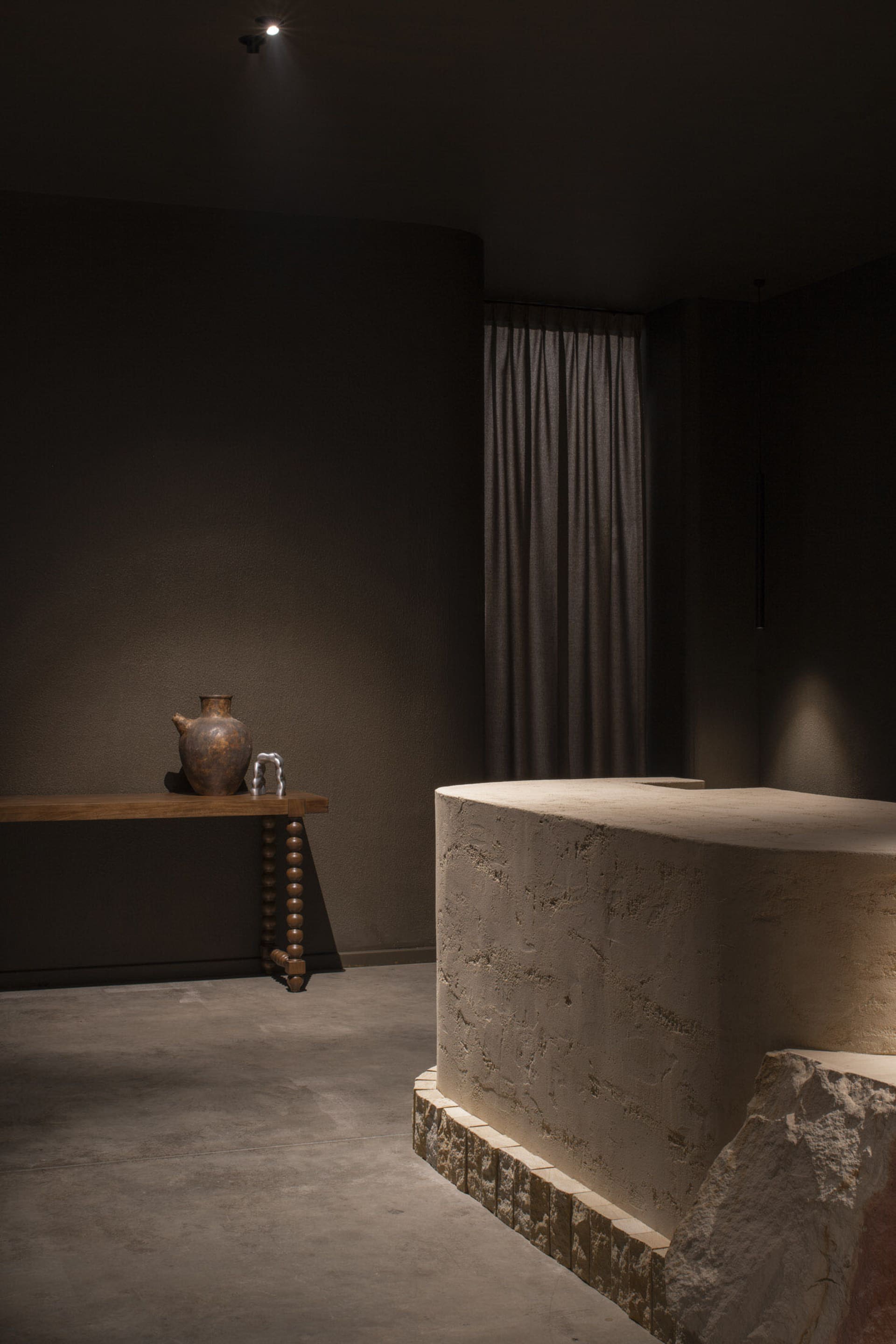 A modern library with a stone platform and a simple, minimalist design.