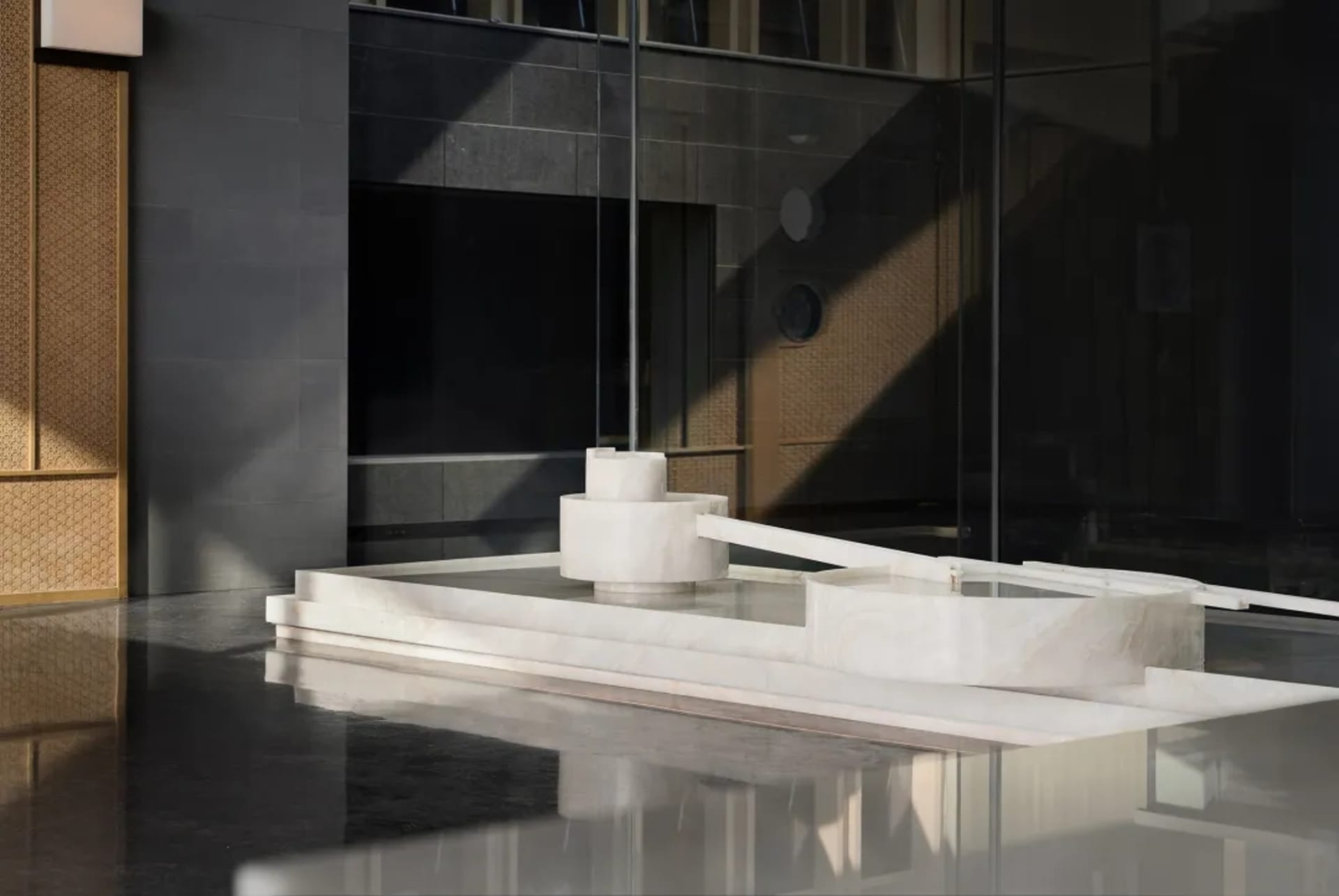 Modern lobby with marble features in a hotel setting.