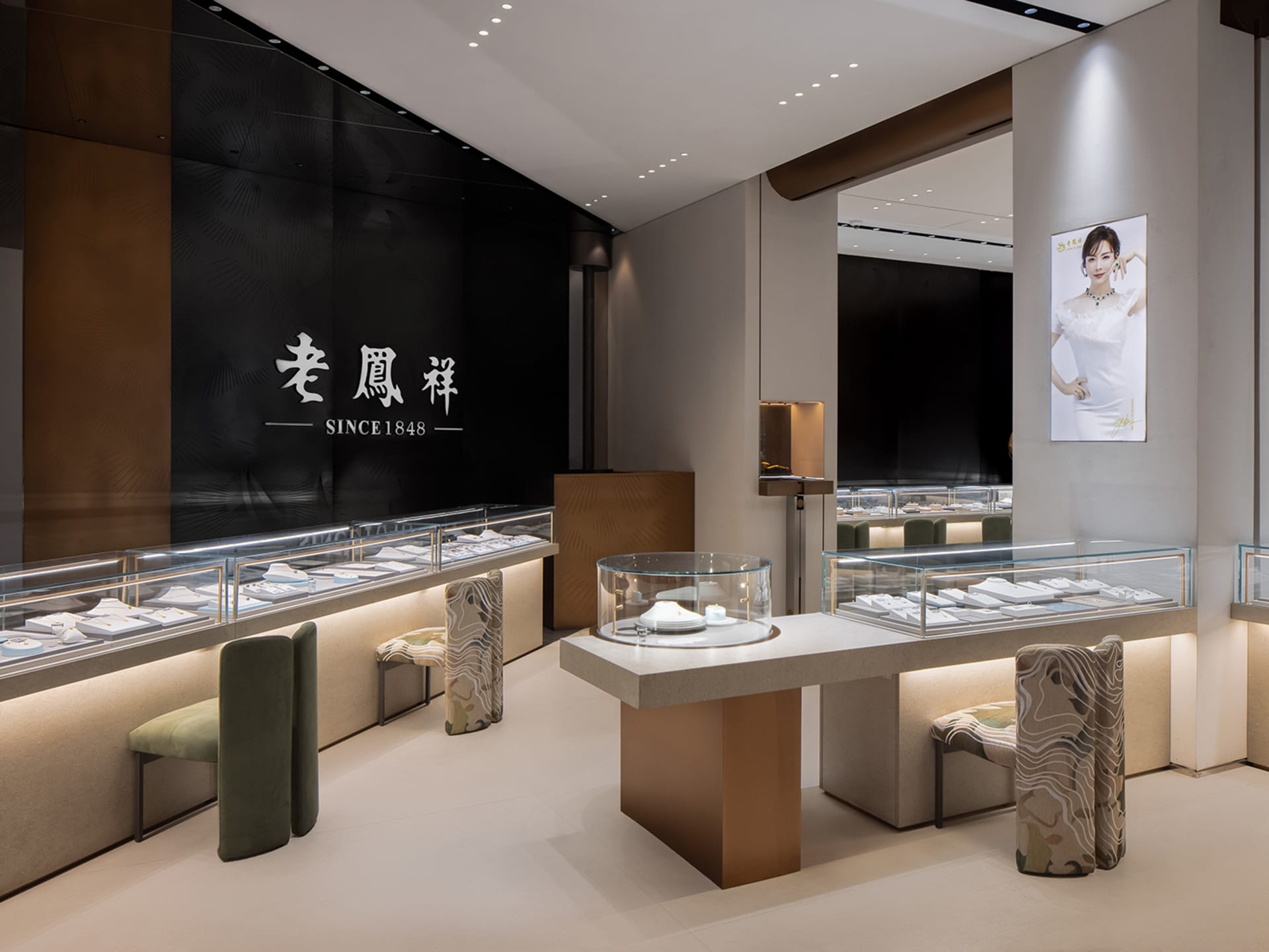 A modern retail store showcasing jewelry in glass display cases with warm lighting.