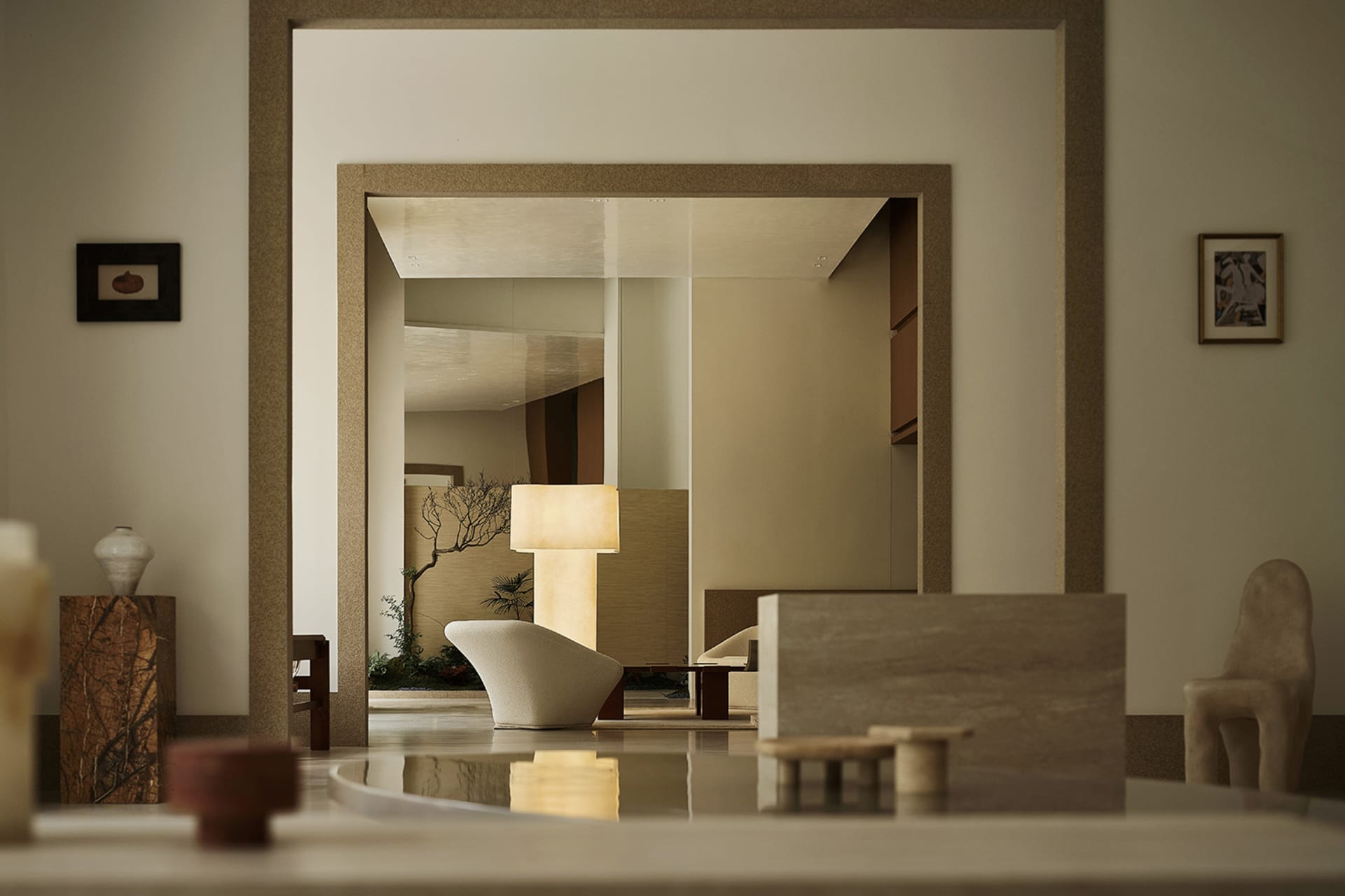 Modern living room with neutral-toned furnishings and minimalist decor.