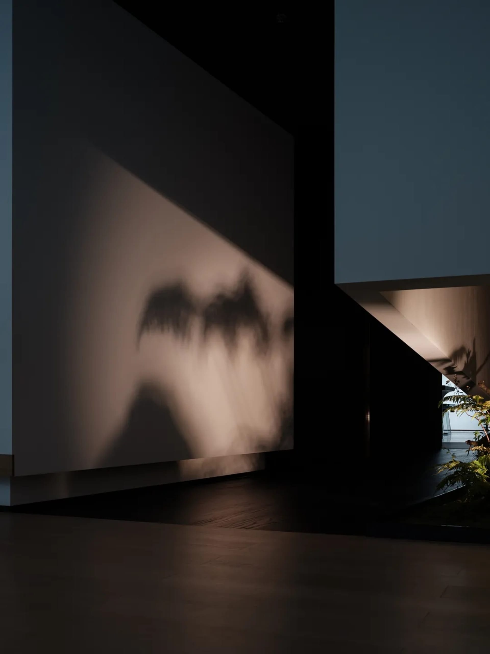 Concrete floor and wall with light fixture reflection