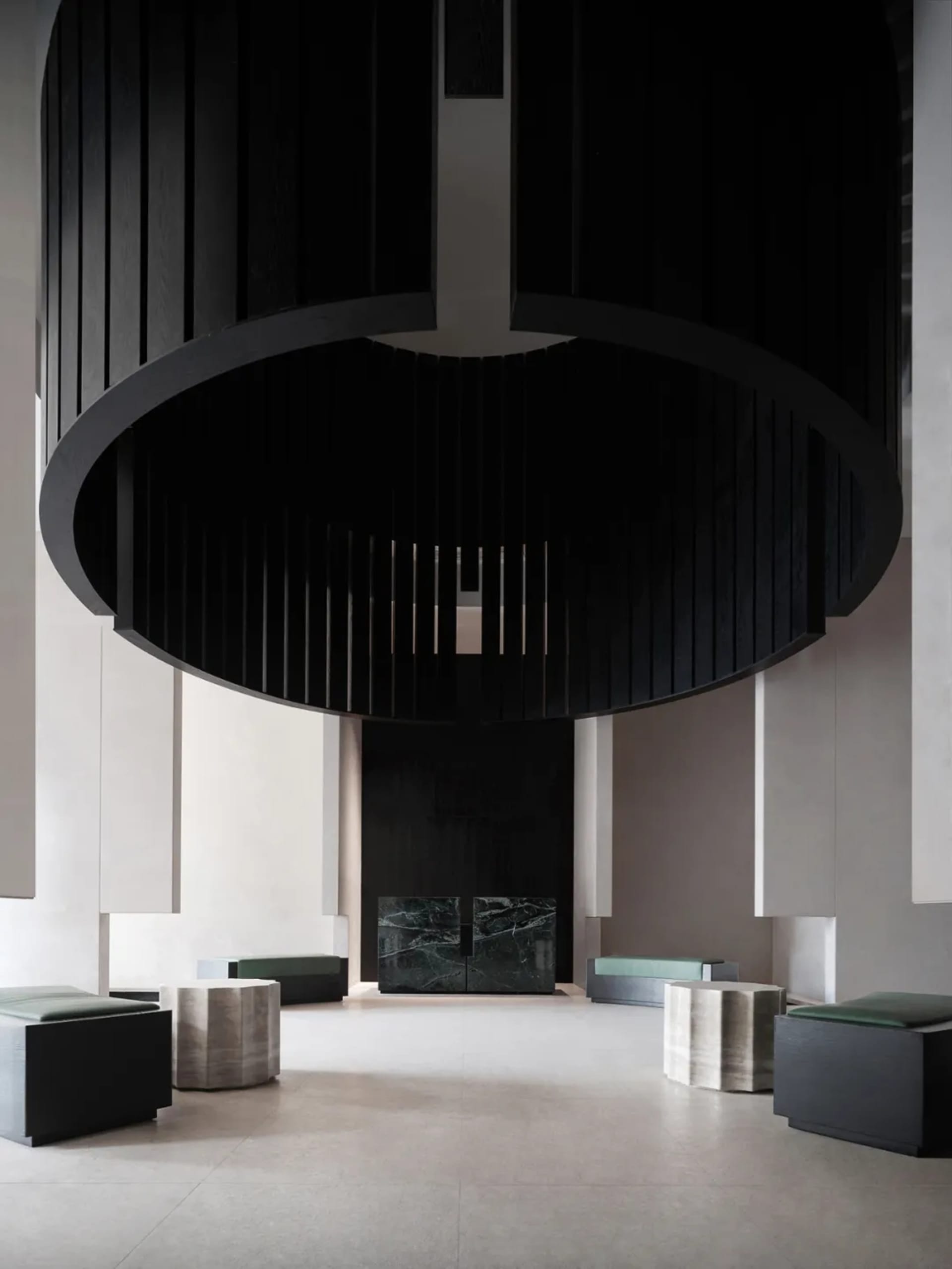 Modern interior design featuring marble, concrete, and metal elements