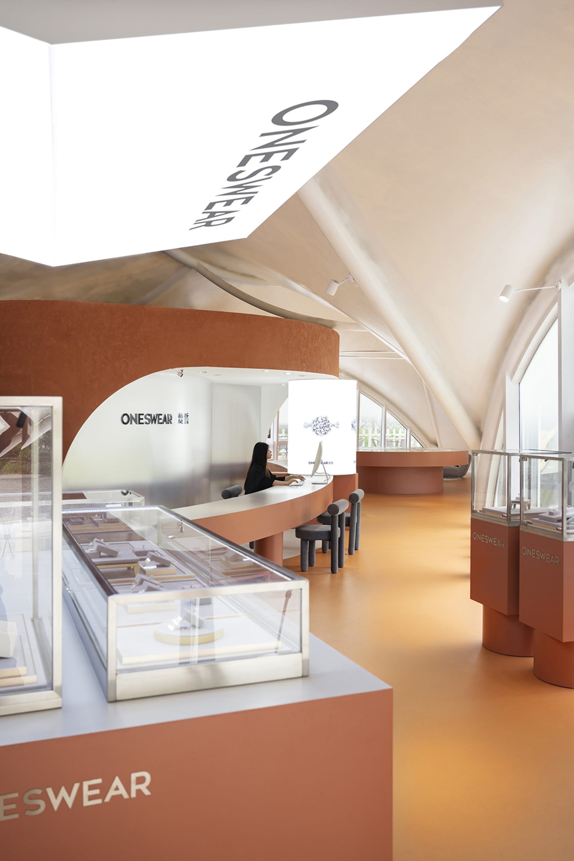 A modern retail jewelry shop featuring a glass display counter.