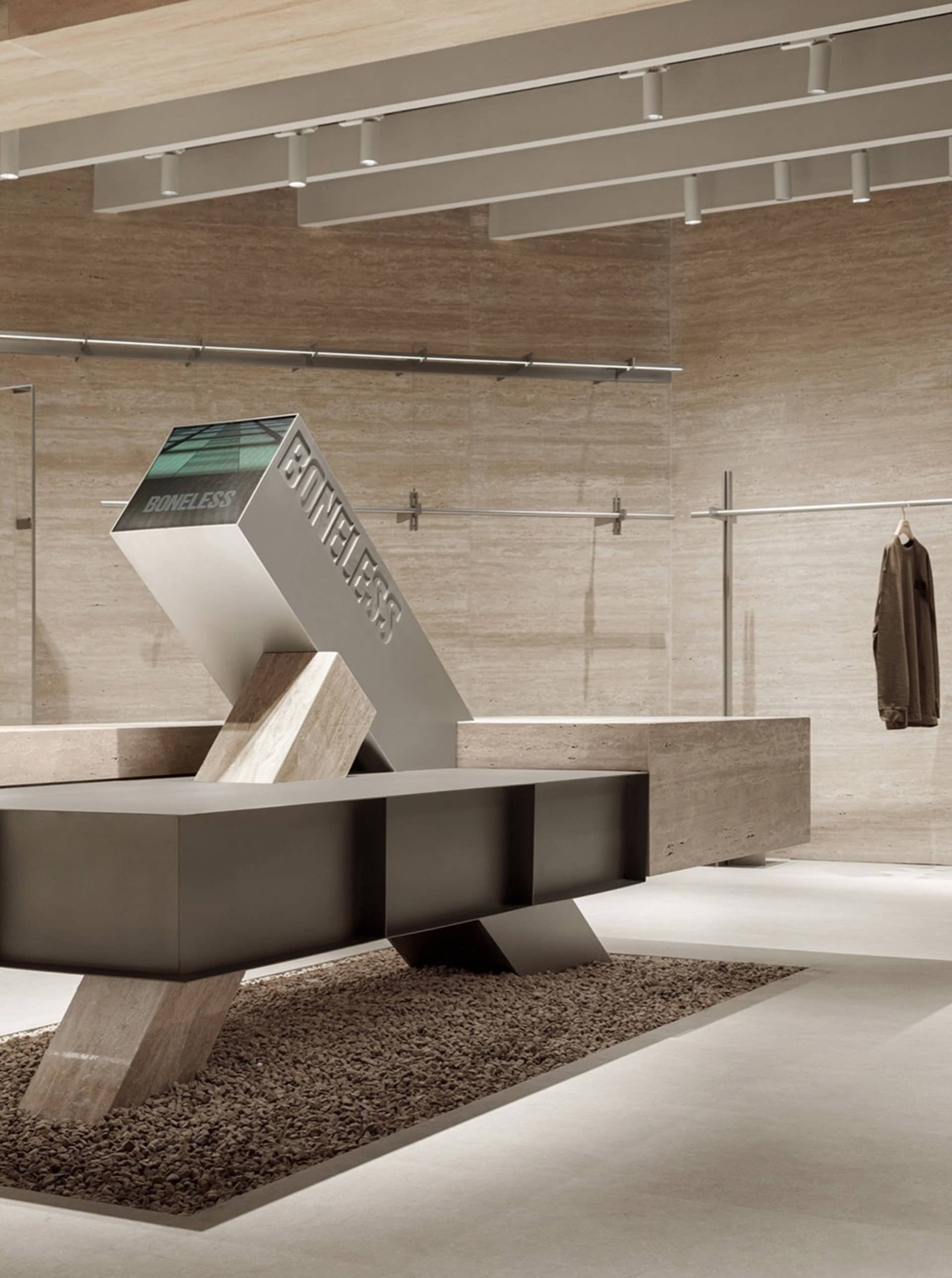 Modern industrial retail space featuring metal, concrete, and glass elements