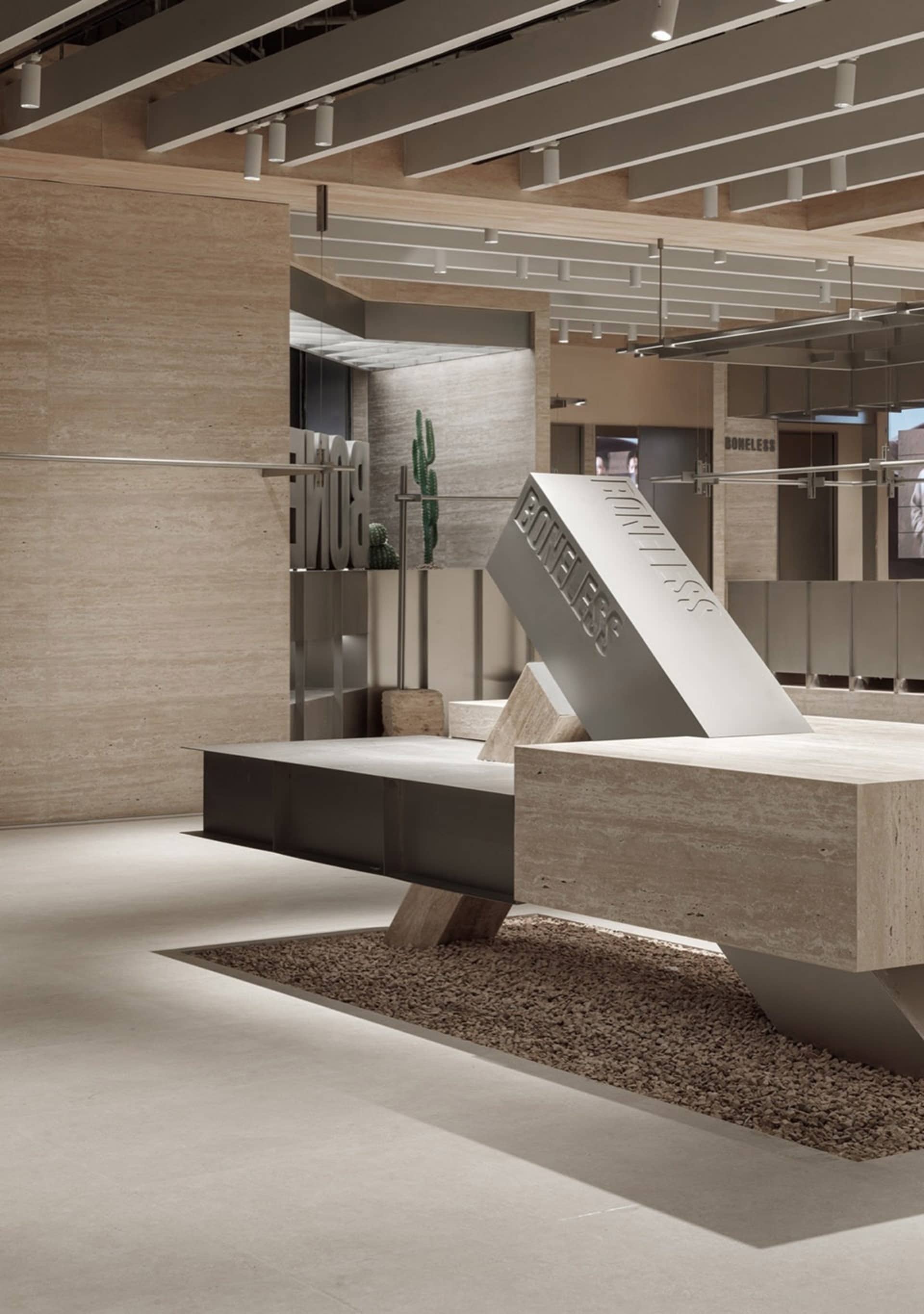 Modern retail store interior featuring exposed concrete walls, minimalist design, and industrial elements.