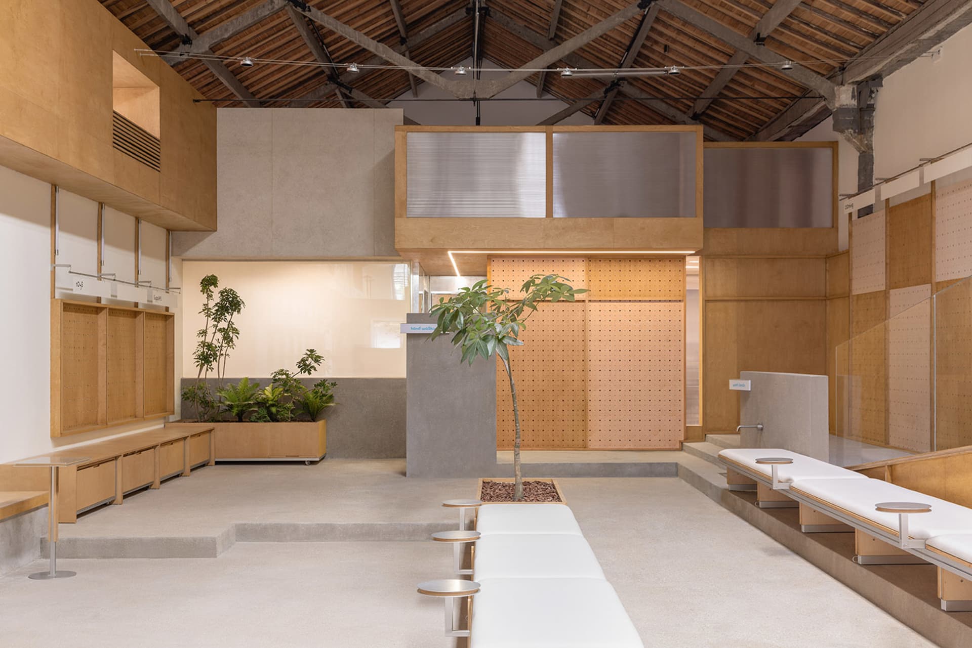 Industrial-style coffee shop with concrete floors and wooden elements