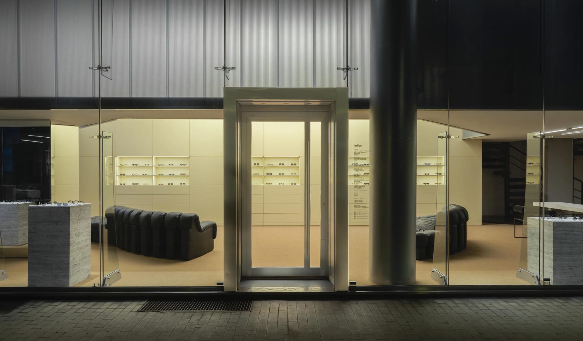 Interior view of a modern retail storefront with a neutral-toned color palette, showcasing a sleek, minimalist design.