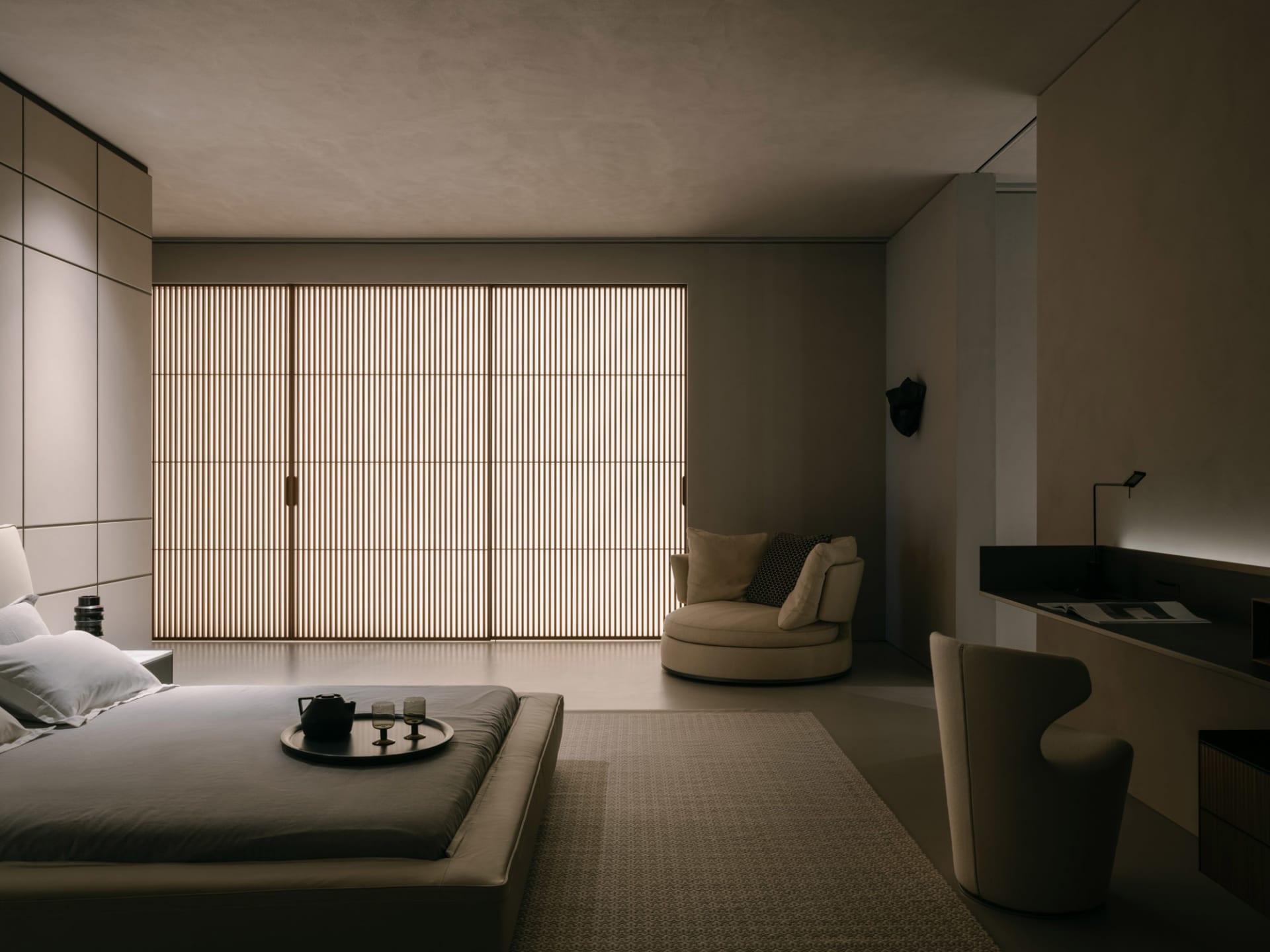A minimalist bedroom with a bed, a round chair, a desk, and a large window with wooden blinds.