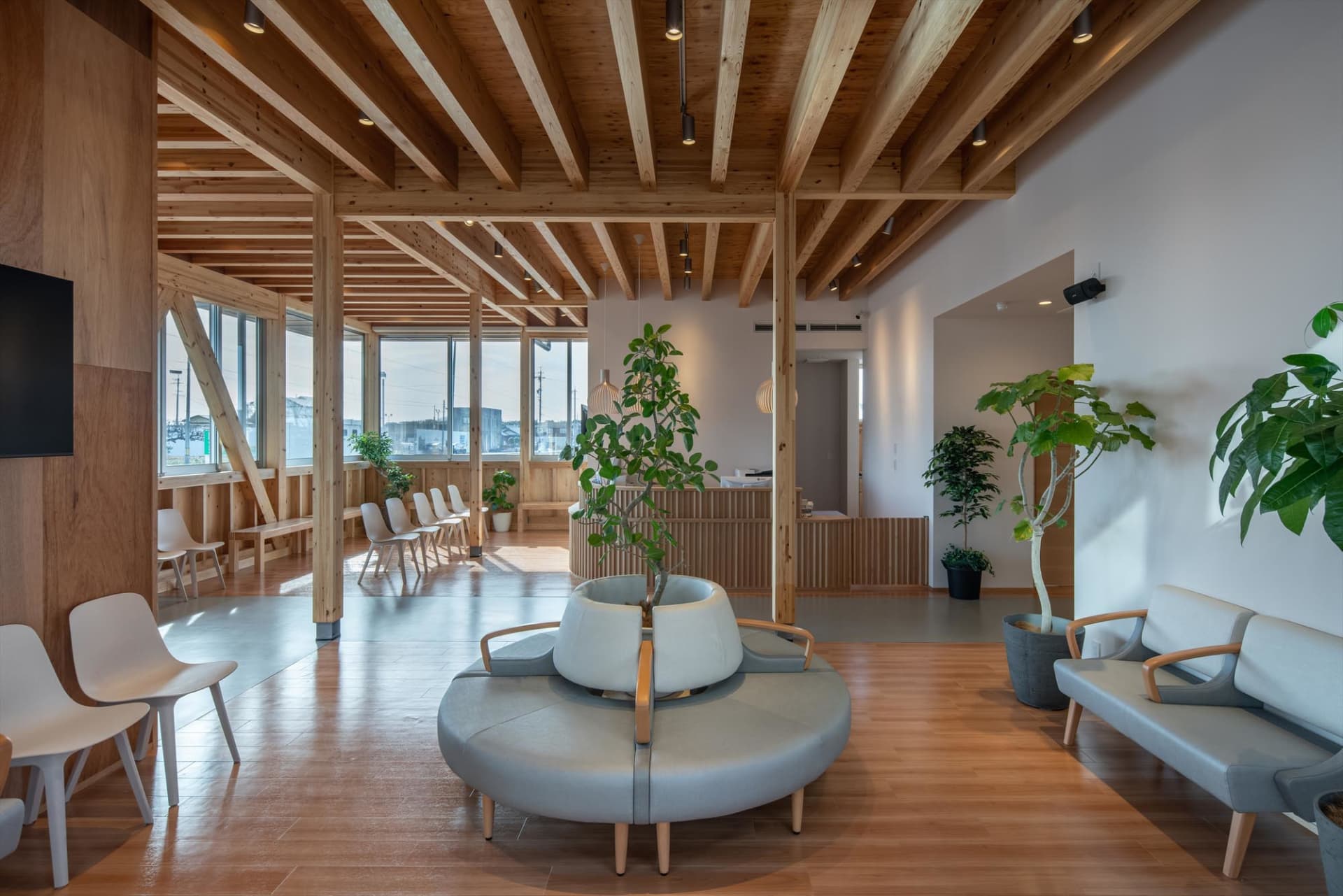 Modern lobby area with wood accents and seating arrangements.
