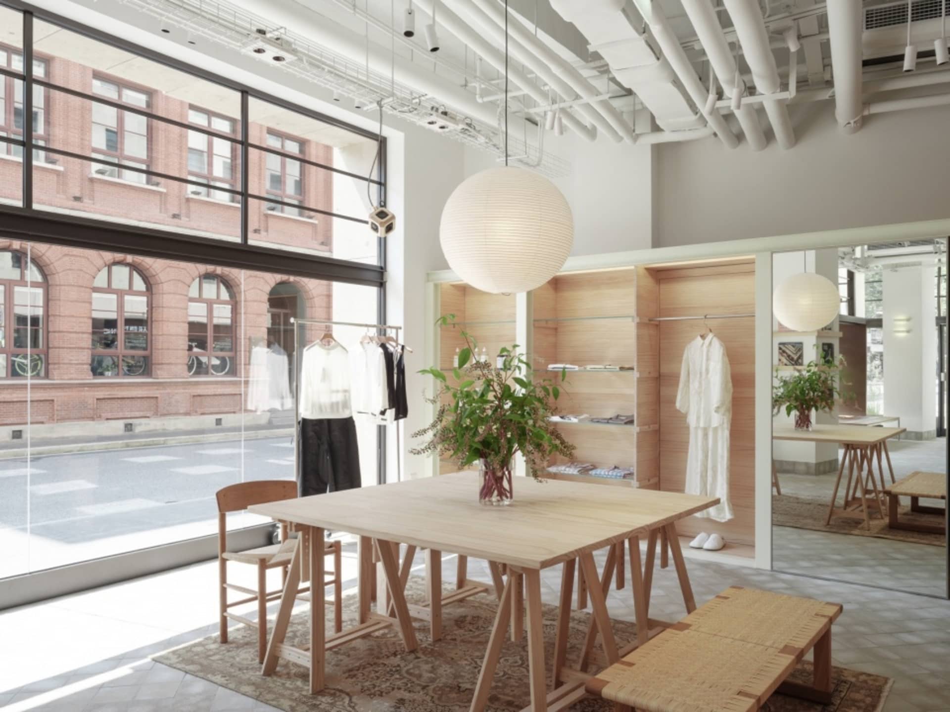 A modern retail shop featuring light wood elements and minimalist design.