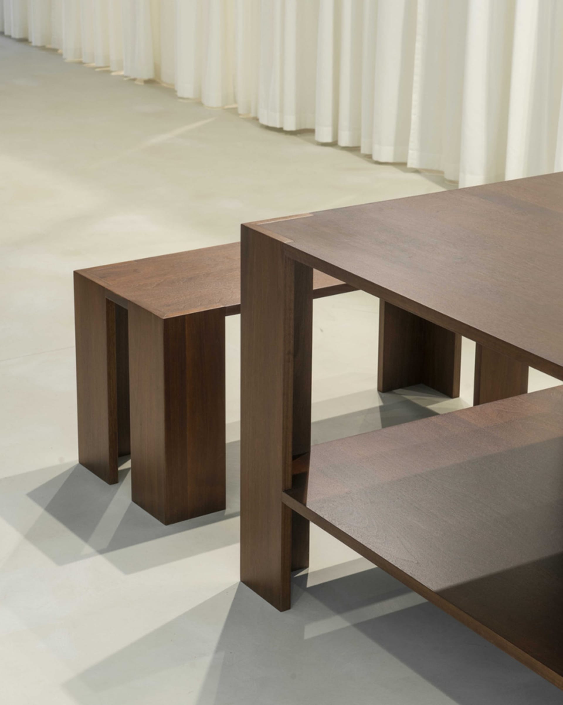 A modern table and benches made of wood.