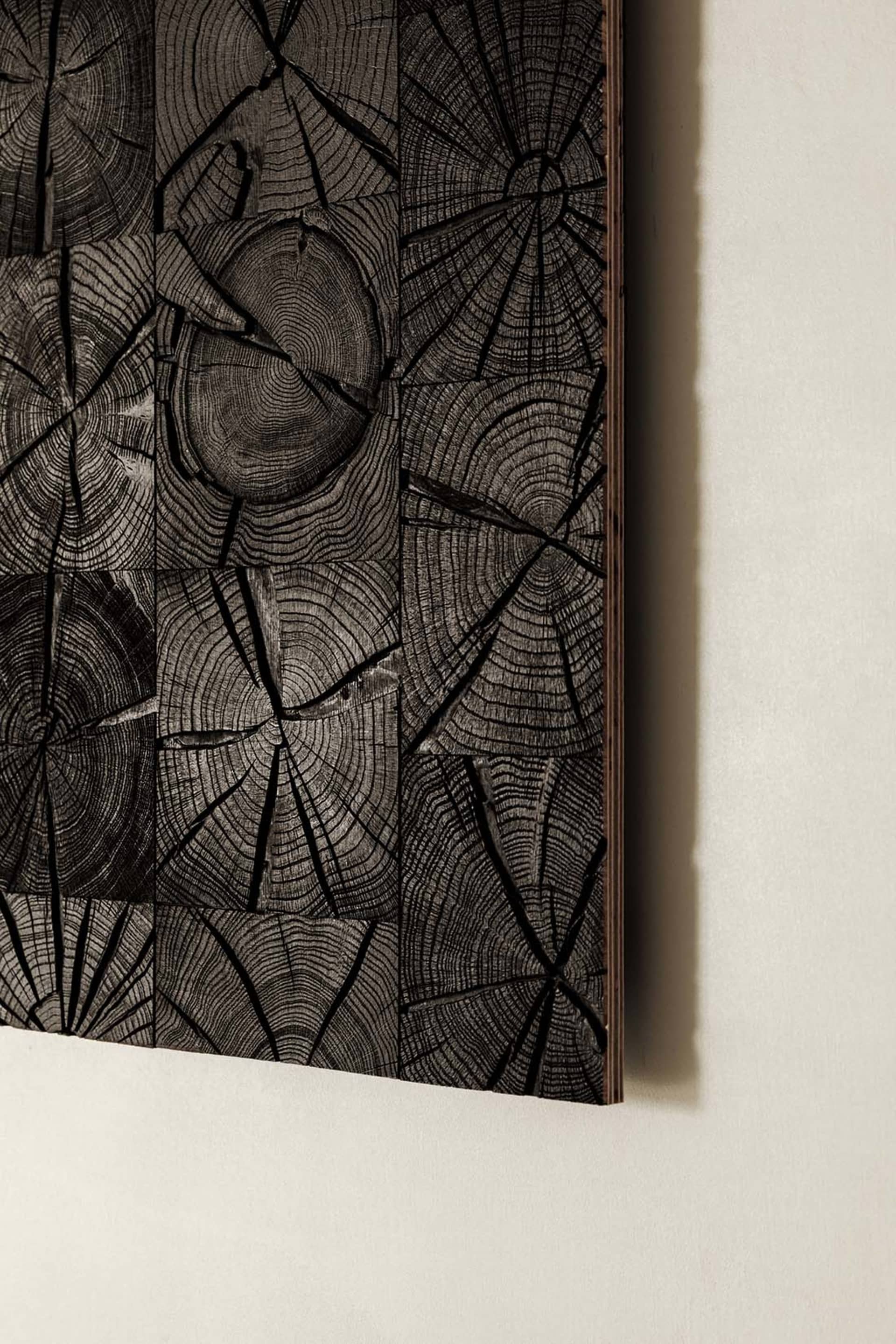 A textured wood panel with a rustic, industrial aesthetic.