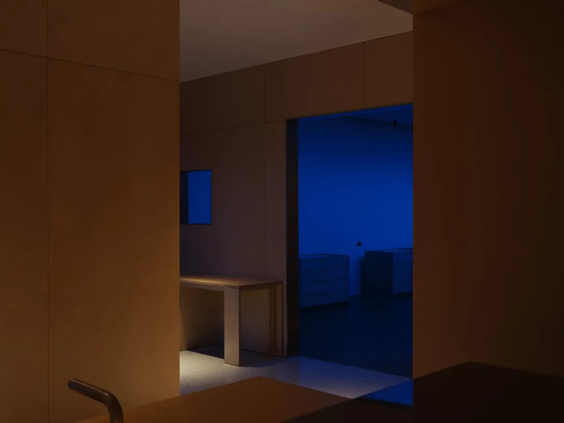 Interior of a modern office featuring minimalist design and concrete materials.