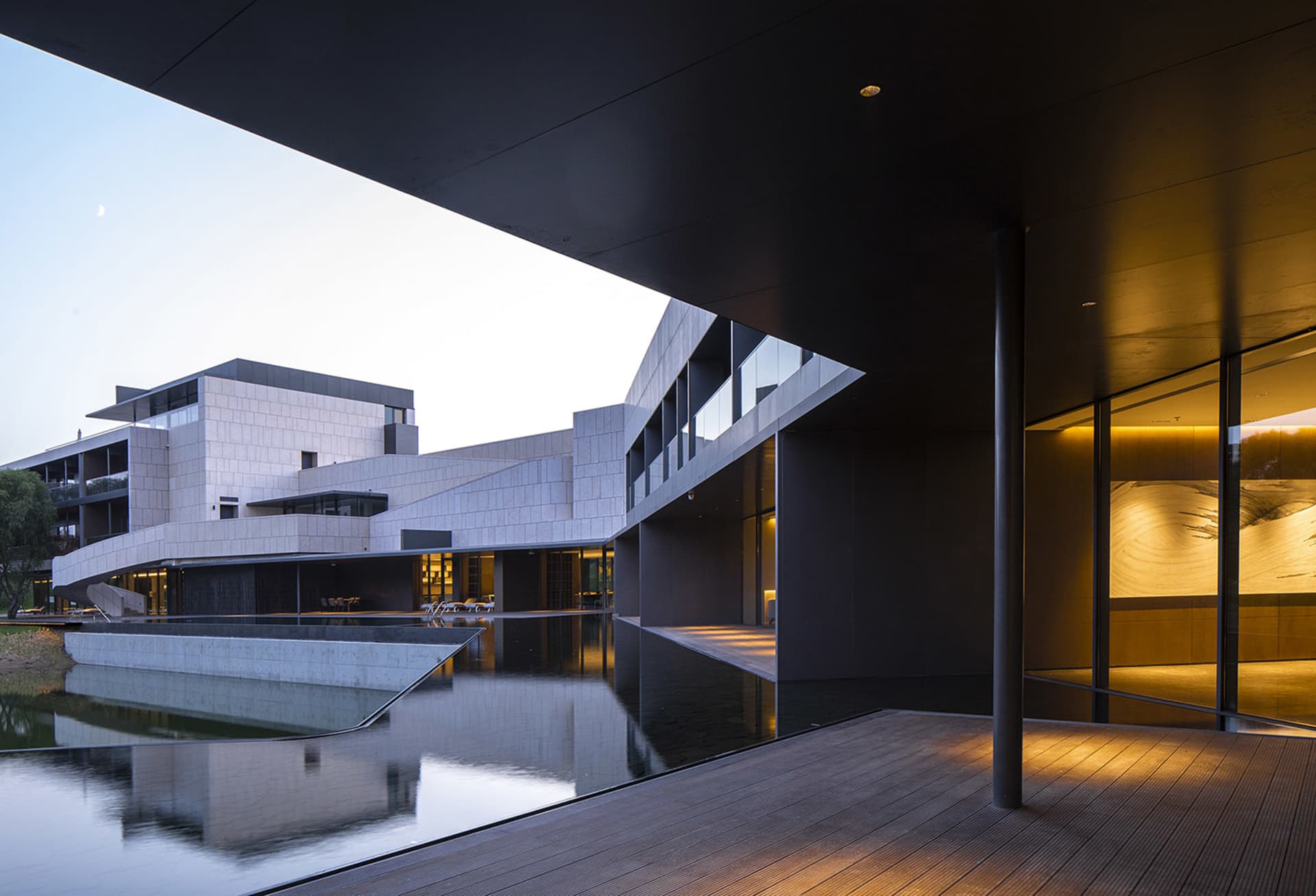 A modern building with glass and concrete exterior materials.