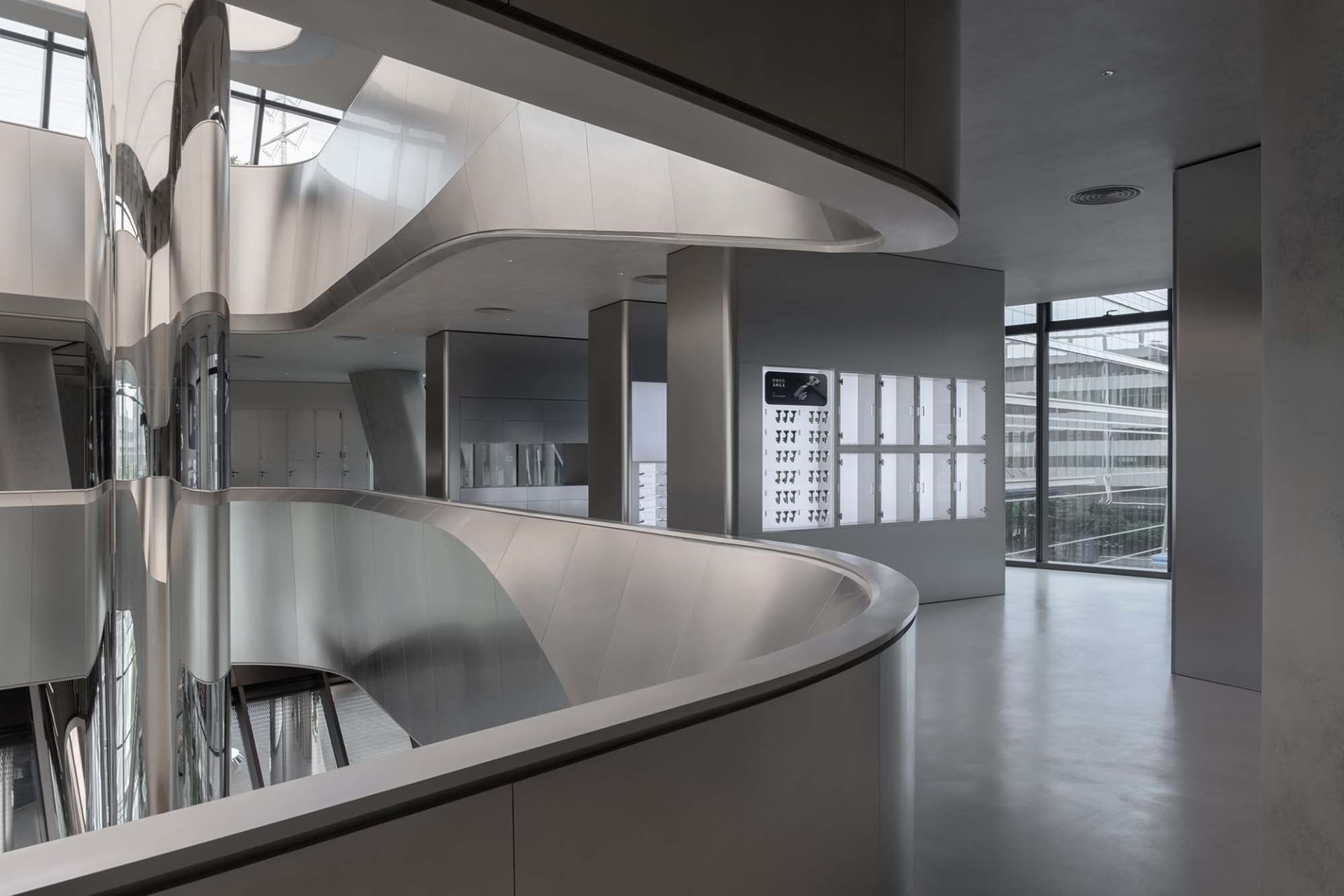 A modern office space with glass partitions.