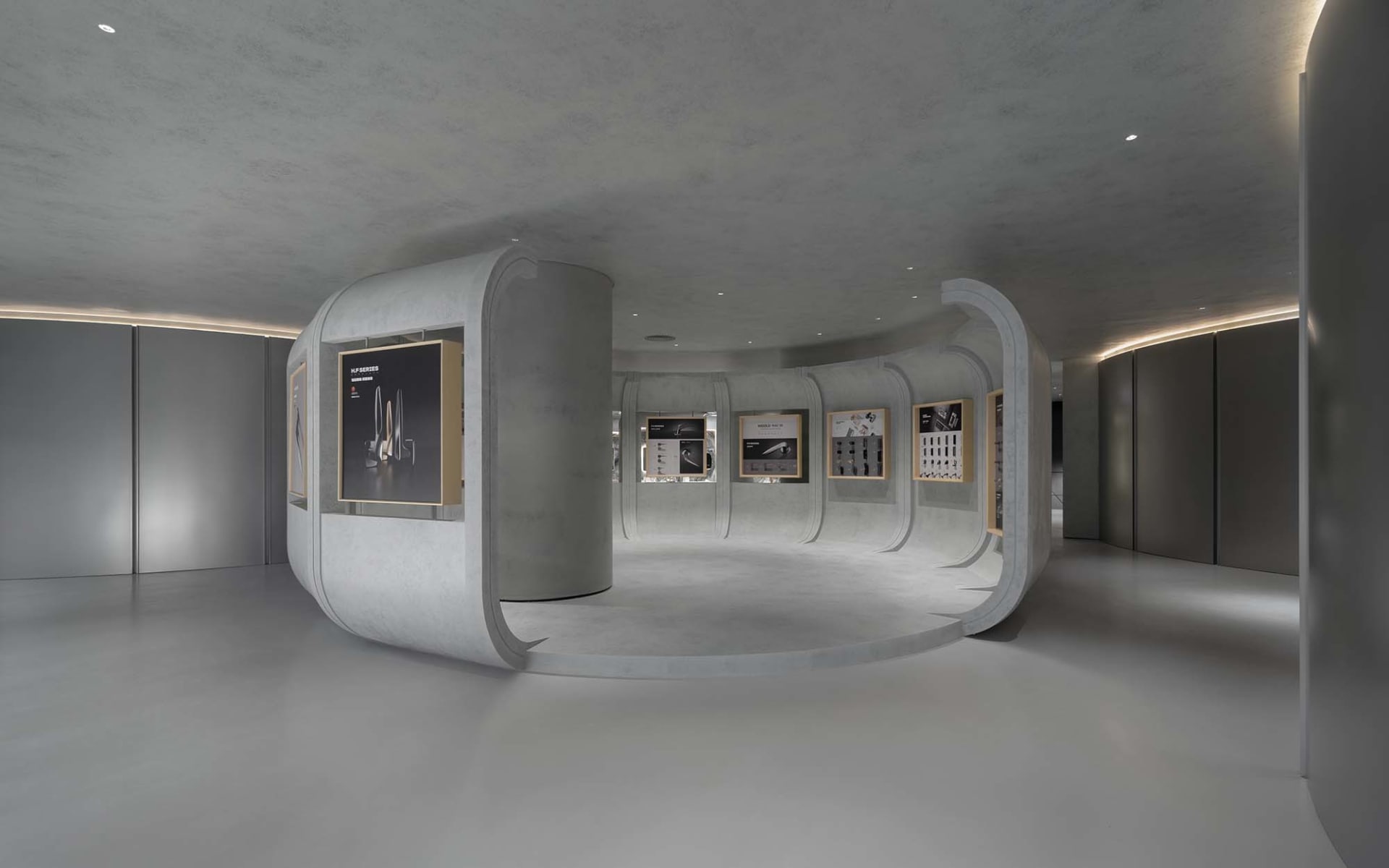 極簡展覽套房,採用混凝土牆面與地板,陳列多件藝術作品與資訊展示。