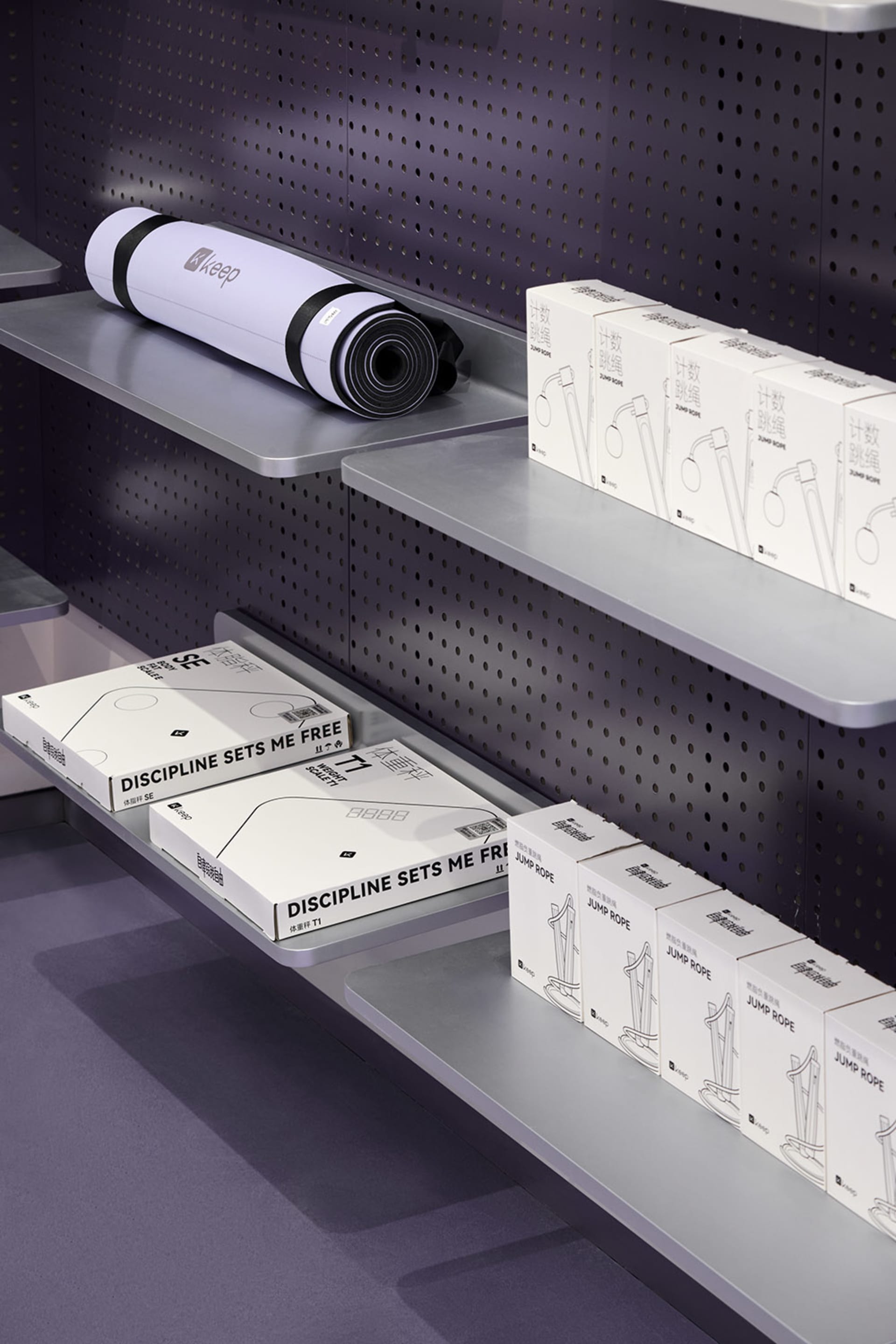Shelves displaying fitness products in a minimalist retail environment.