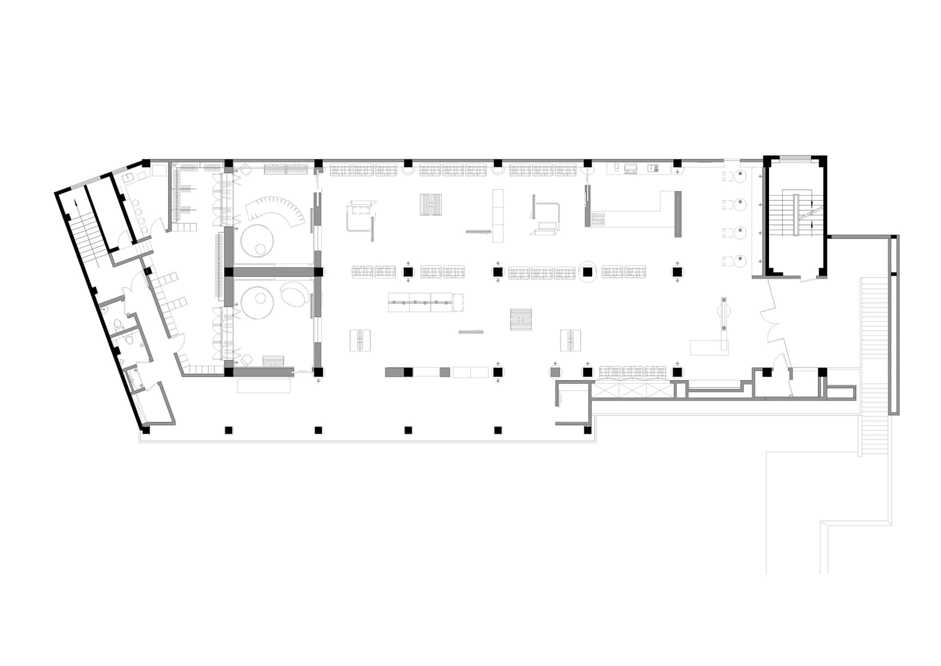 工業風格辦公空間的平面圖,展示開放式工作站與會議區域。