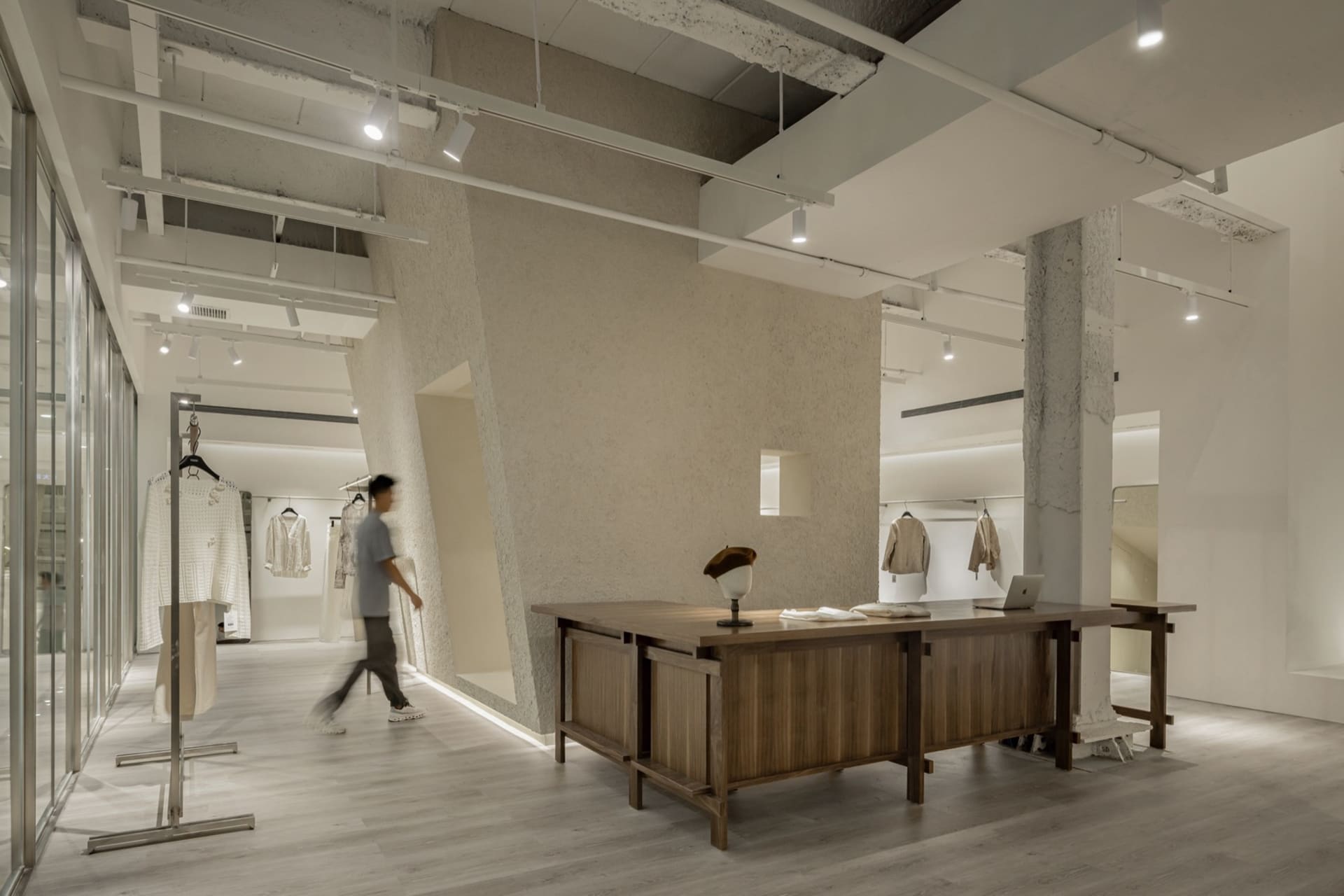 Modern retail store with concrete walls and minimalist design.