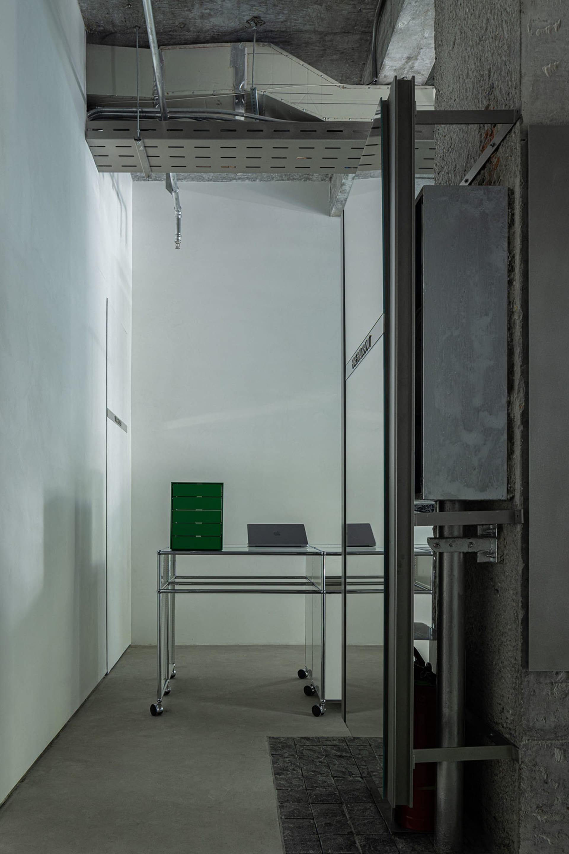 Modern office interior with concrete and metal materials.