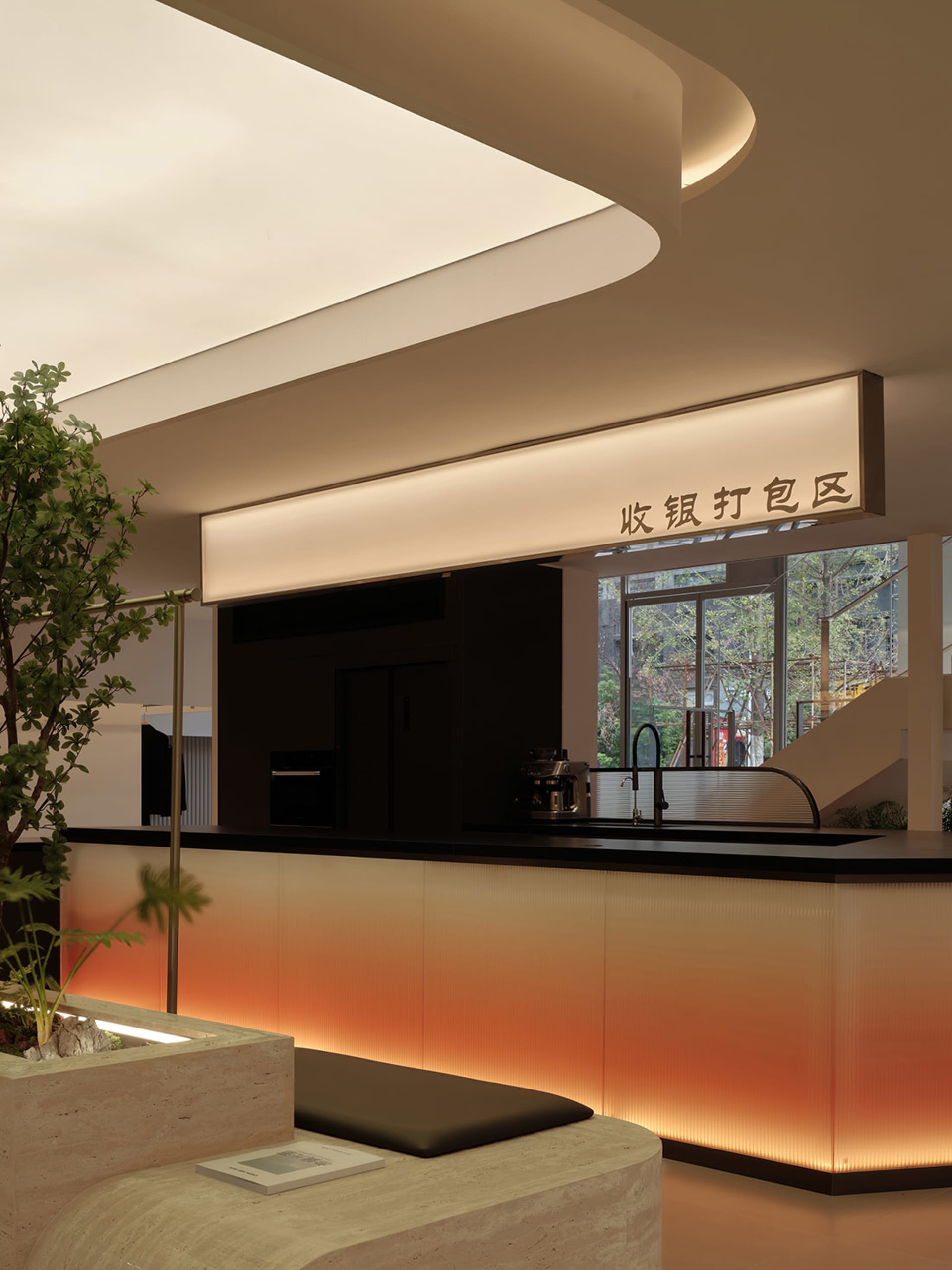 A modern coffee shop with a glass counter showing sleek design features