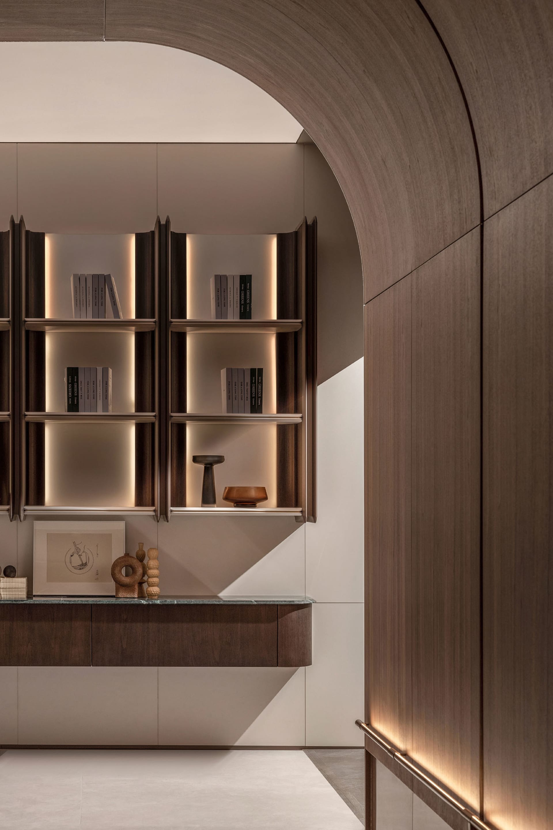 A modern library with floating shelves and wooden paneling.