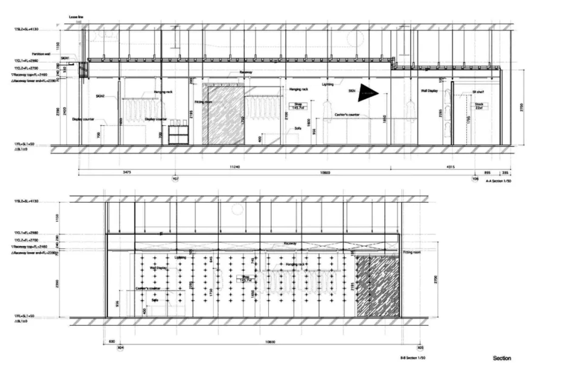 Modern retail layout with display racks, counter, and fitting room
